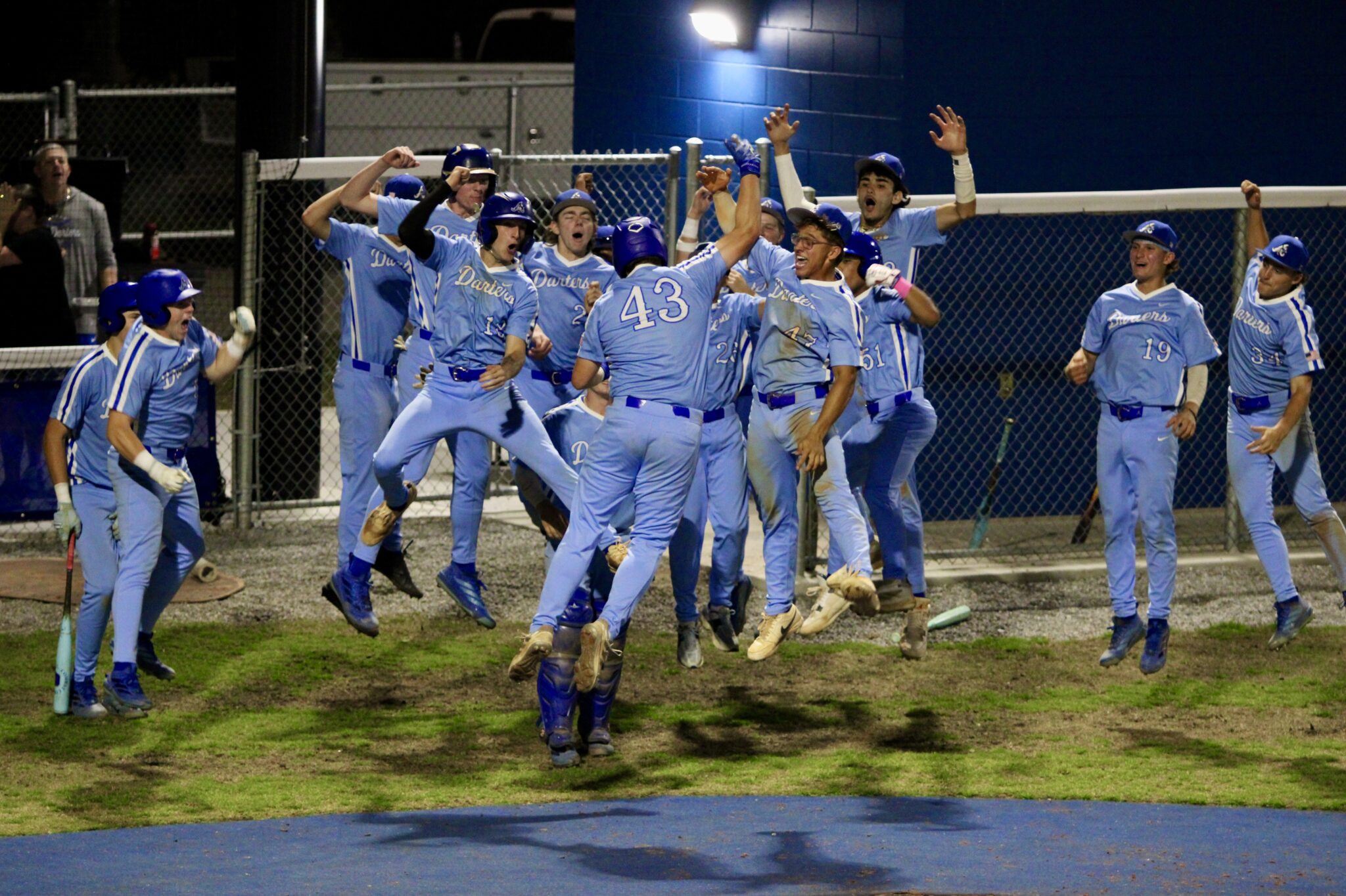 Blue Darters yell BOOM in celebration of Anthony Raymond's (43) game-ending grand slam against Wekiva