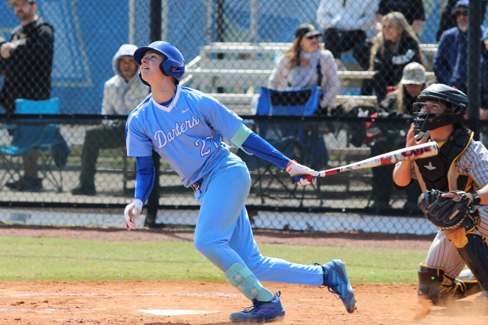 Camron Pennock rips the ball into the left field air to advance Ty Livingston to third