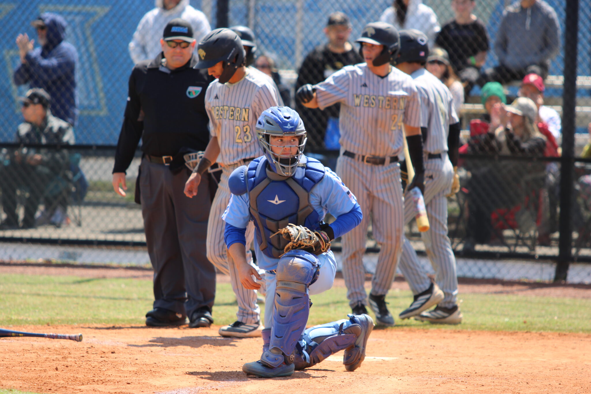 Collin Van Fleet catches the late throw after a runner scores behind him