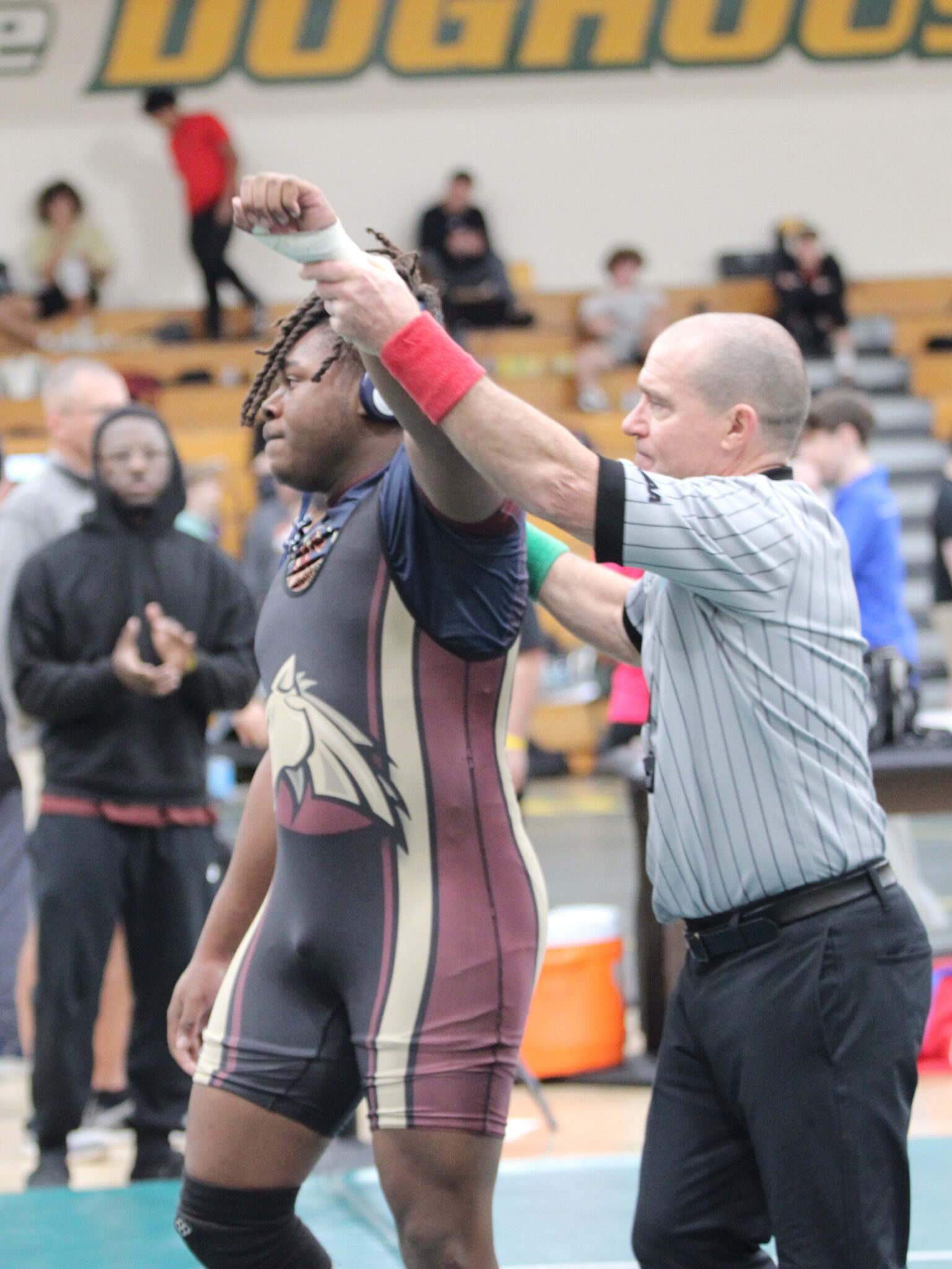 Elijah Jean gets his hand raised in round 1 of the regional tournament