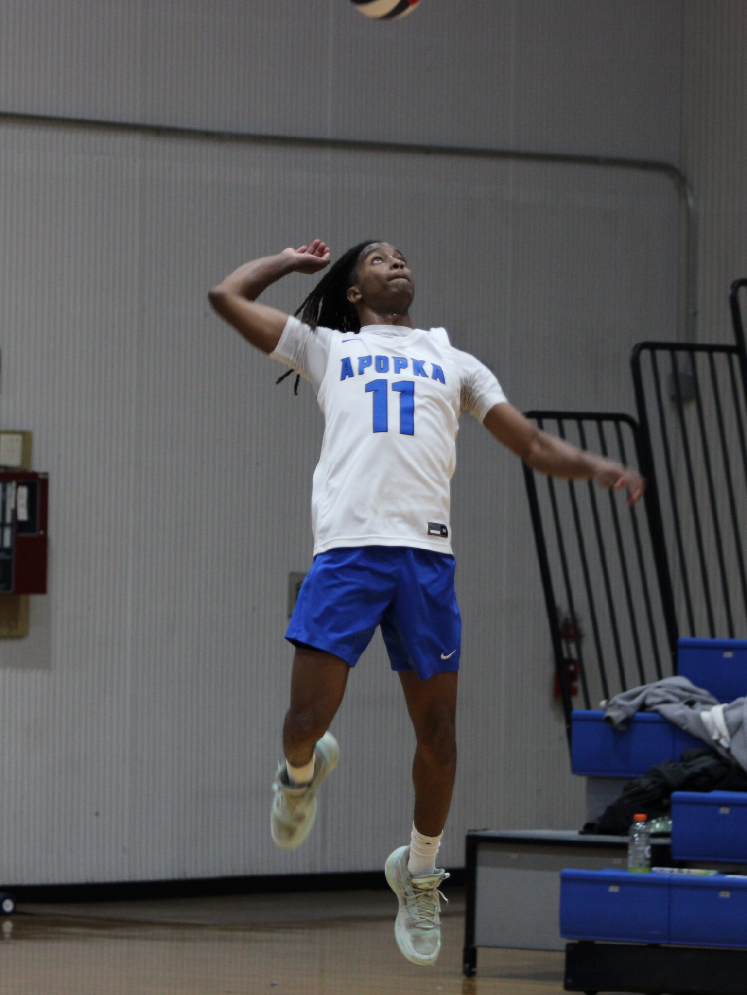 Elzie Robinson winds up for a big serve in the fourth set against Forest Lake Academy