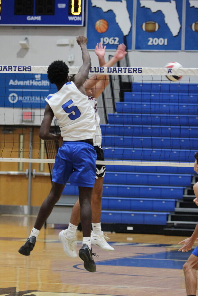 Giovanni Lubin spikes one past the hands of the Seminole middle blocker