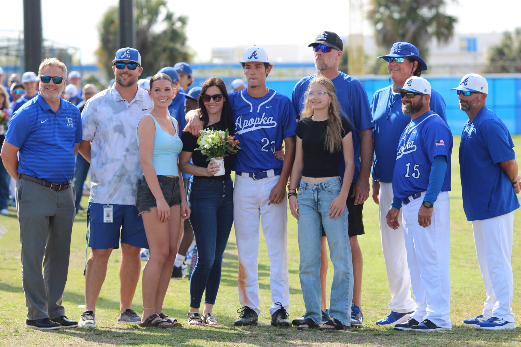 JD Edge with his family, coaches, Athletic Director Jordan Walker, and Principal Heinz on senior night