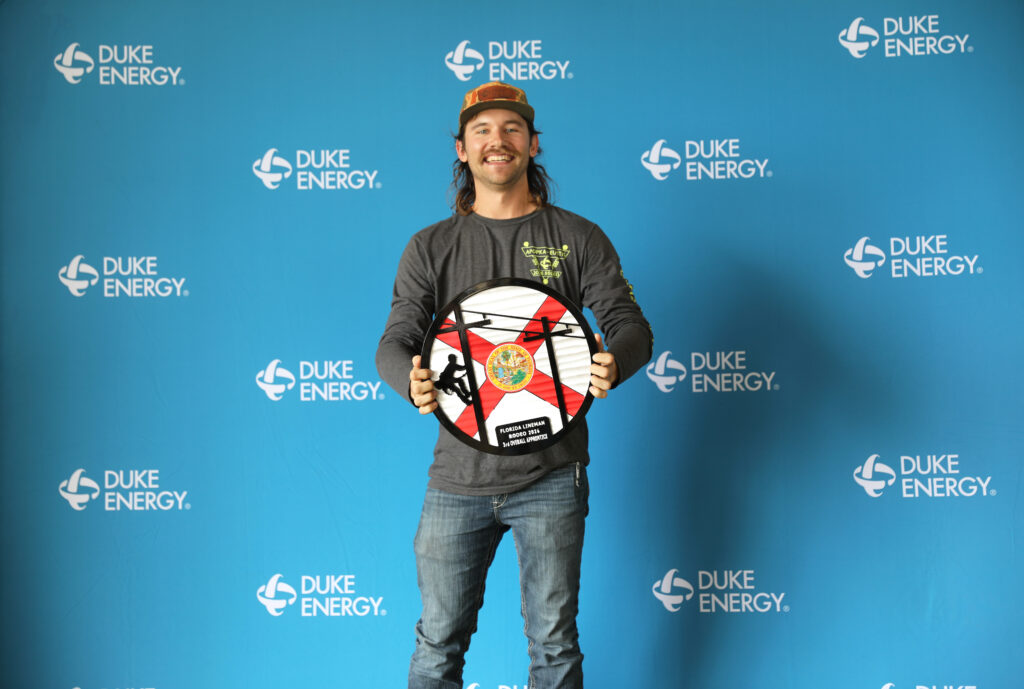 Jeremy Neumann poses with his award.
