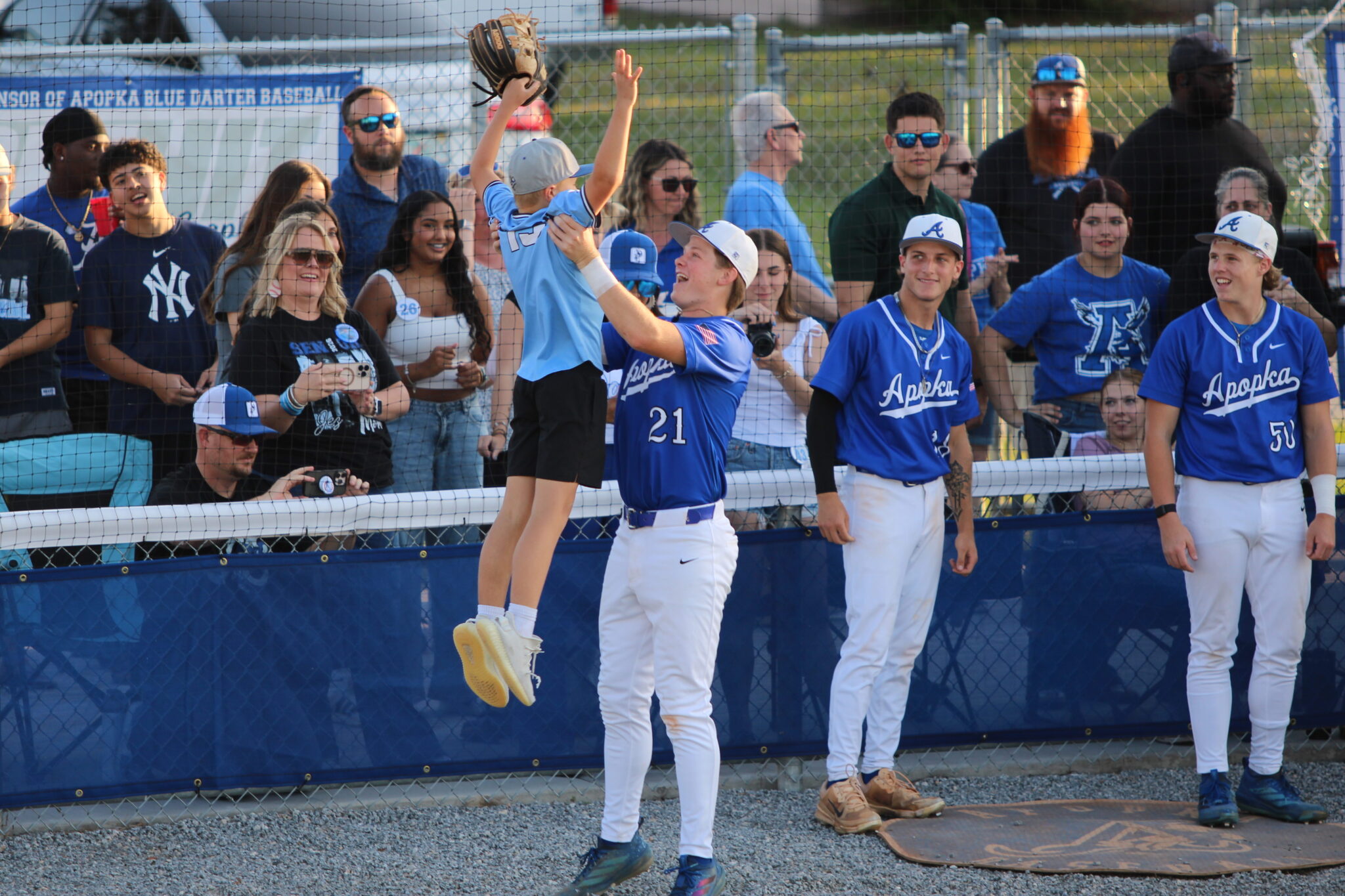 Jez Hamrick is introduced in the starting lineup and runs out to lift his little brother for his special senior night entrance