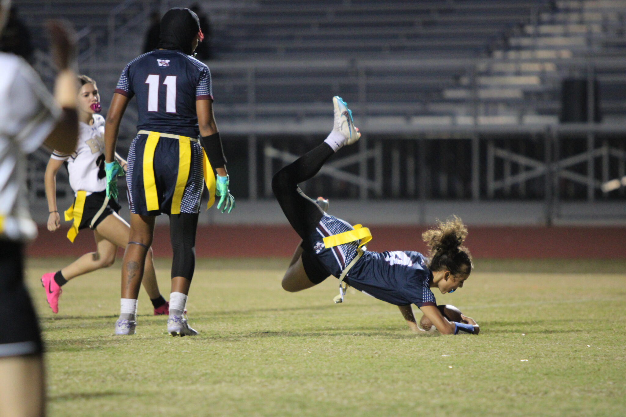 Kiamora Antrum quarterback sneaks through the defense and dives across the goalline to convert the point after the touchdown