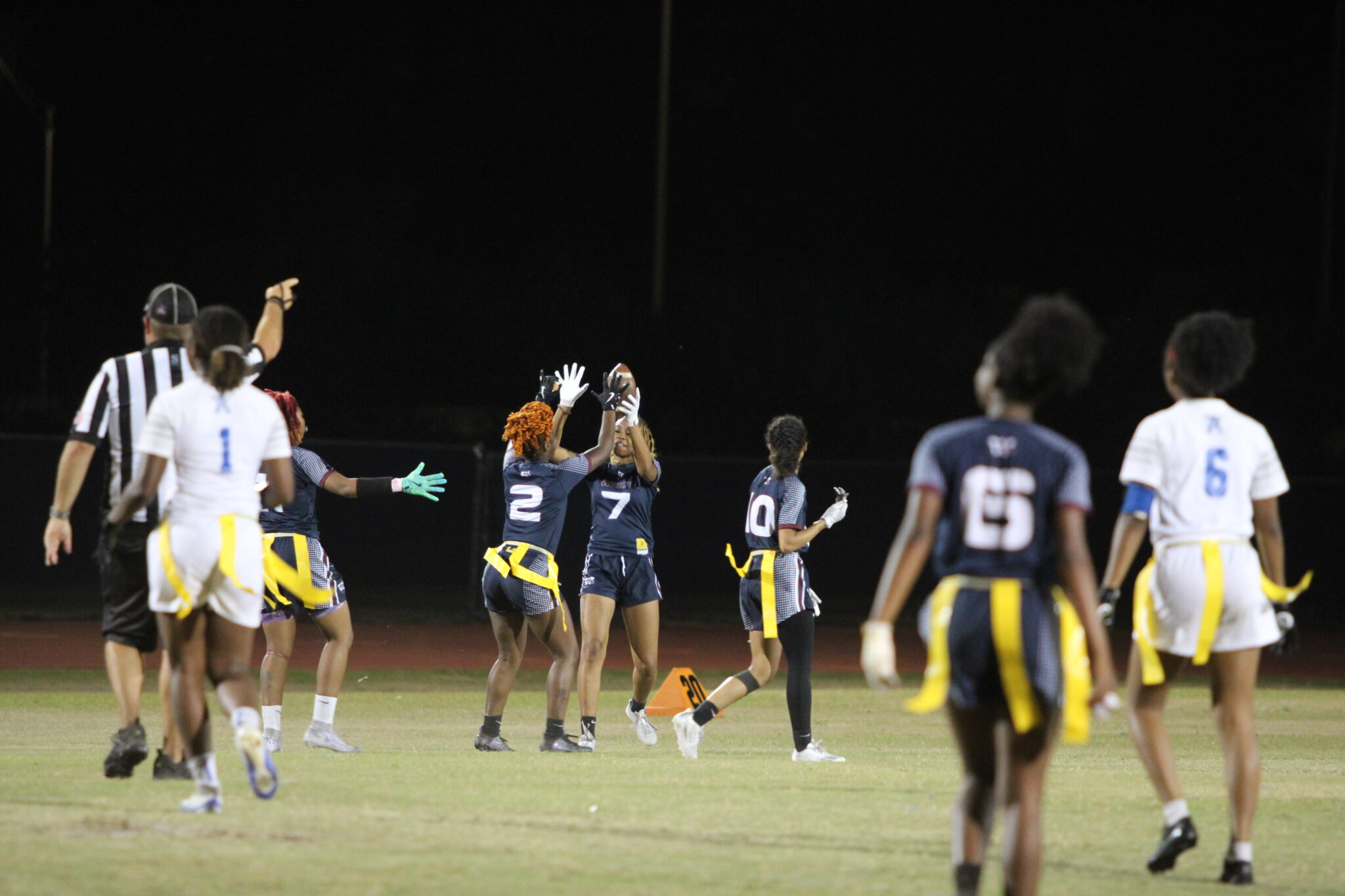 Kimani Miller (2) and Ayonna Hunt (7) high five after Hunt's huge interception and return