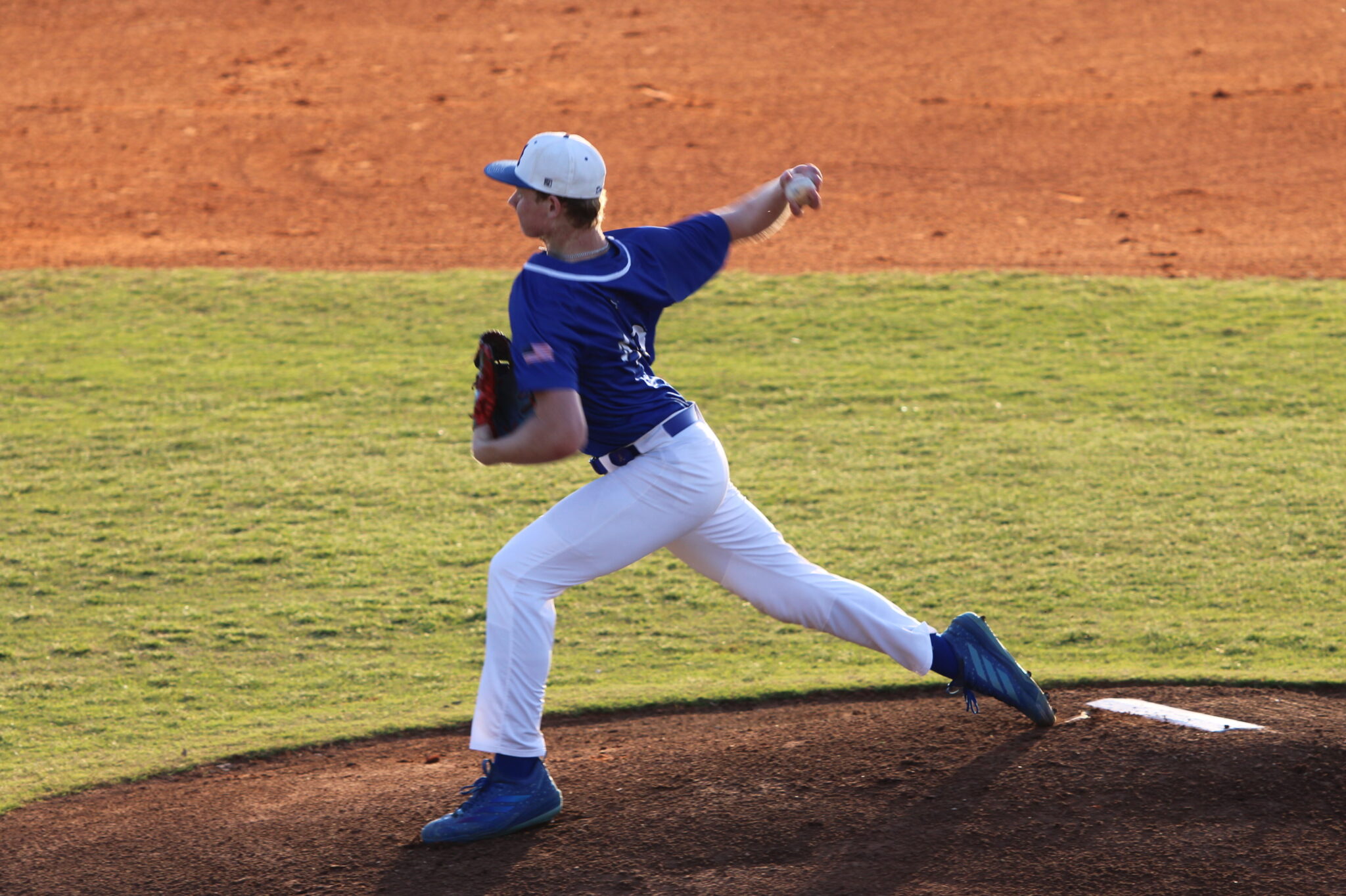 Logan Page whips in a pitch against the first batter on senior night
