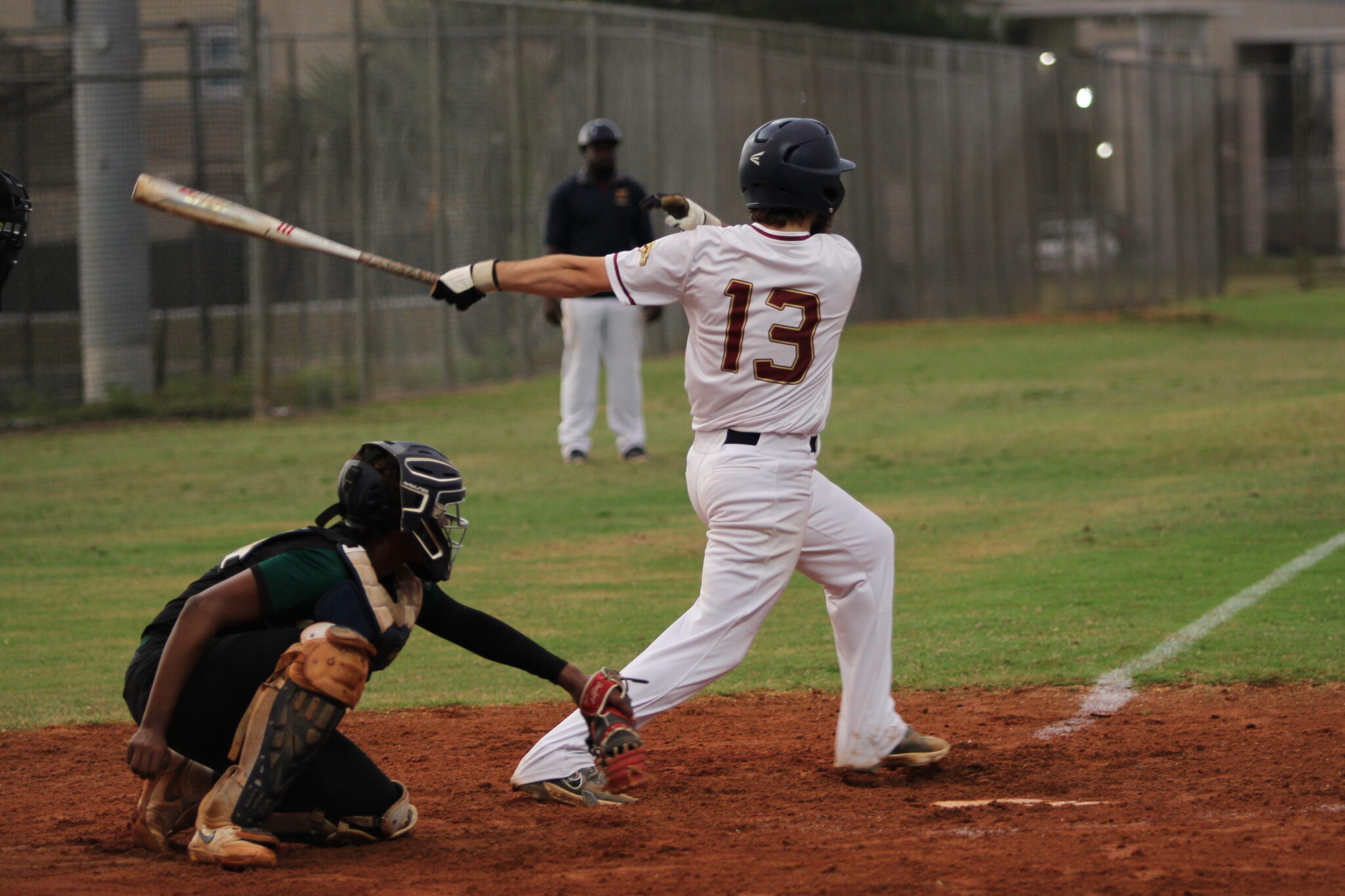 Luke Robinson drives a ball to shortstop to advance a runner home