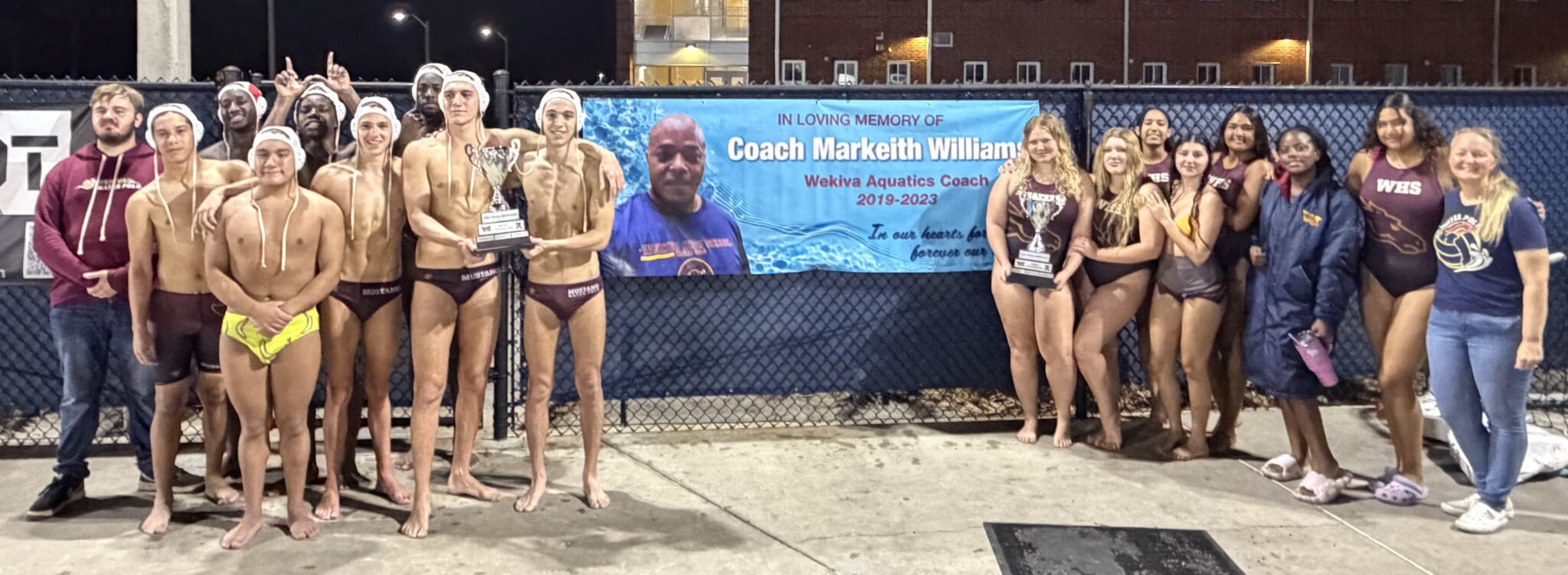Mustangs Water Polo poses with their Tidal Wave Cups after wins over Apopka