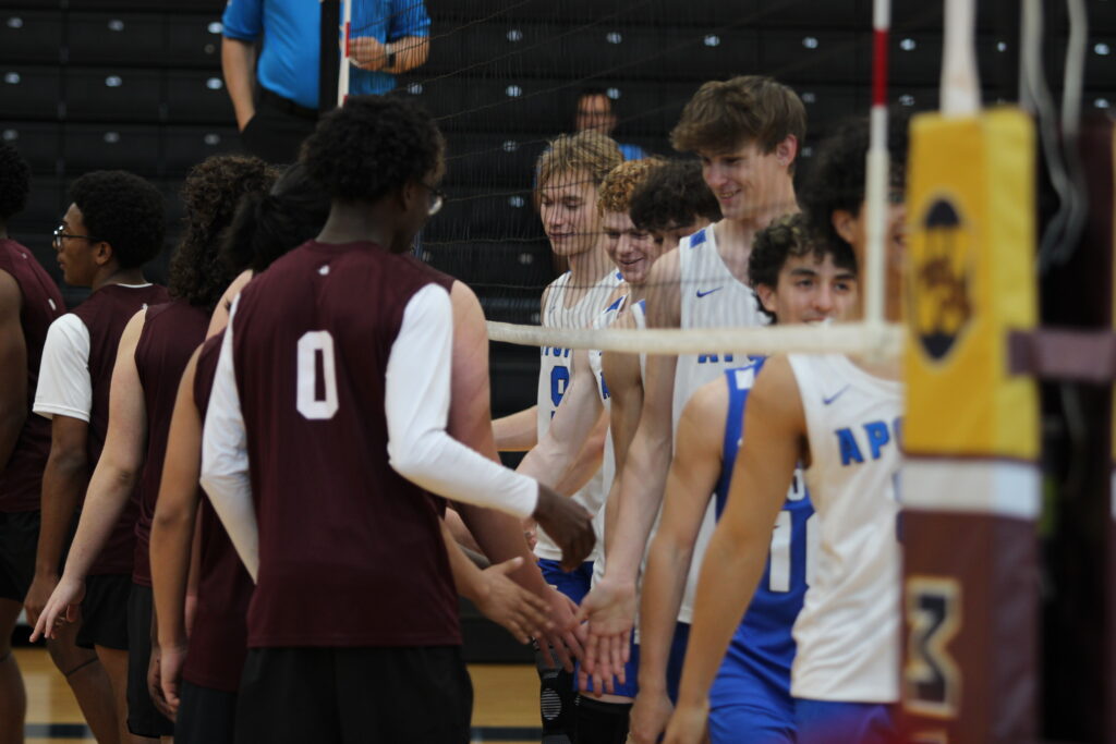 Mustangs and Blue Darters shake hands ahead of their volleyball matchup in Wekiva