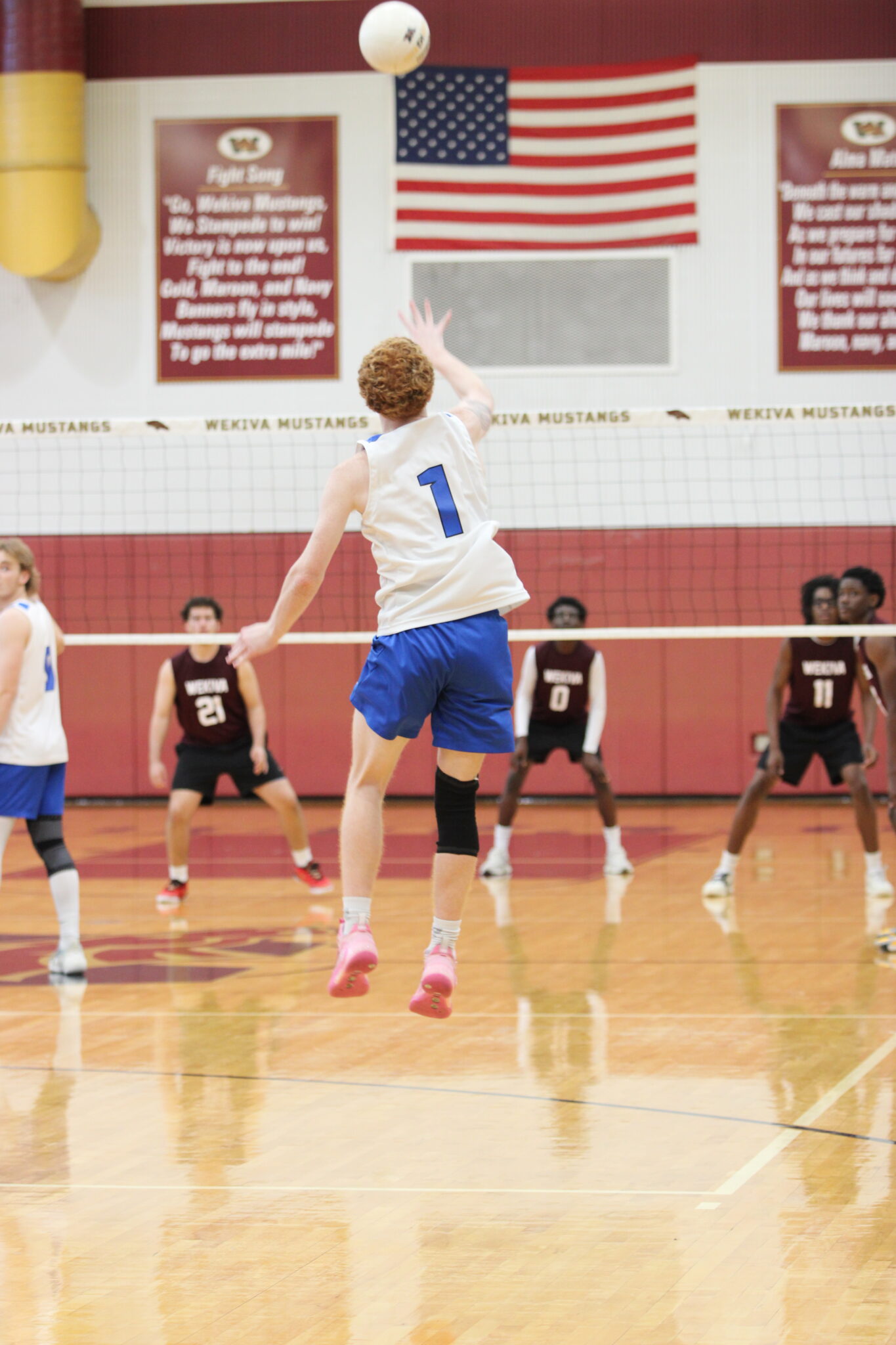 Nathan White beams a serve over the nets to Wekiva
