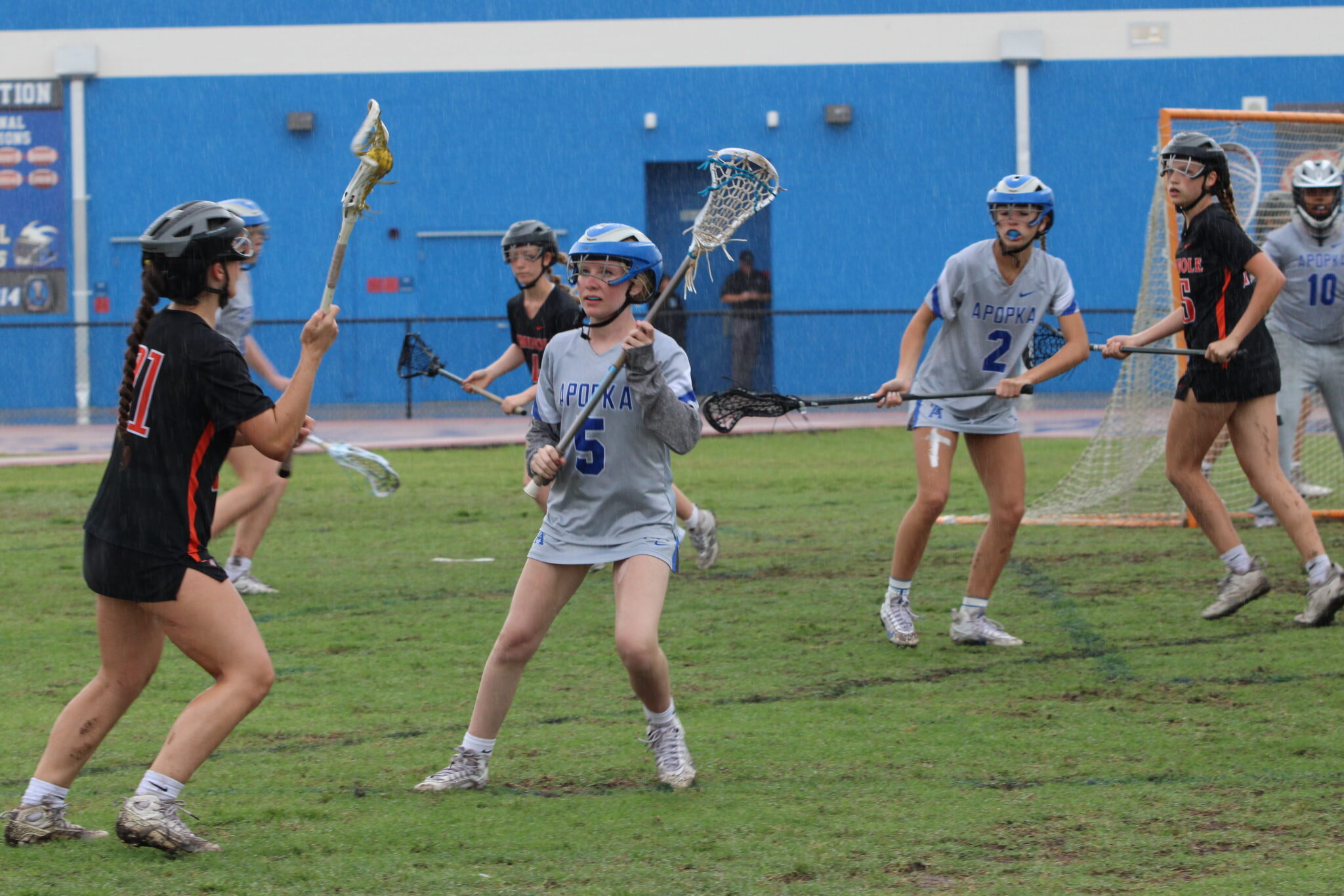 Olivia Davis playing defense on a Seminole player from getting to the net