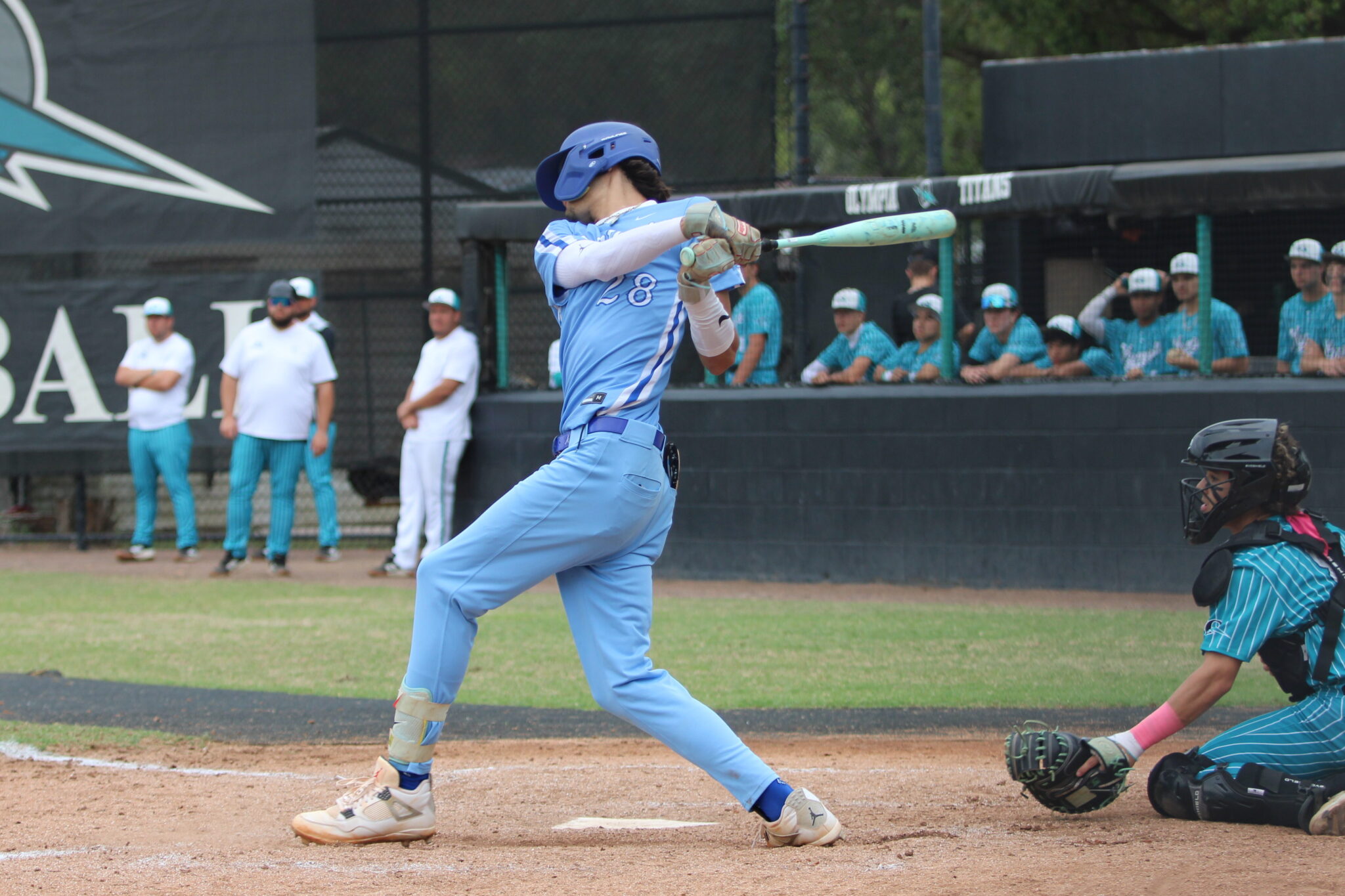 Senior Tyler Spaid rips a 2 RBI shot into center field against Olympia