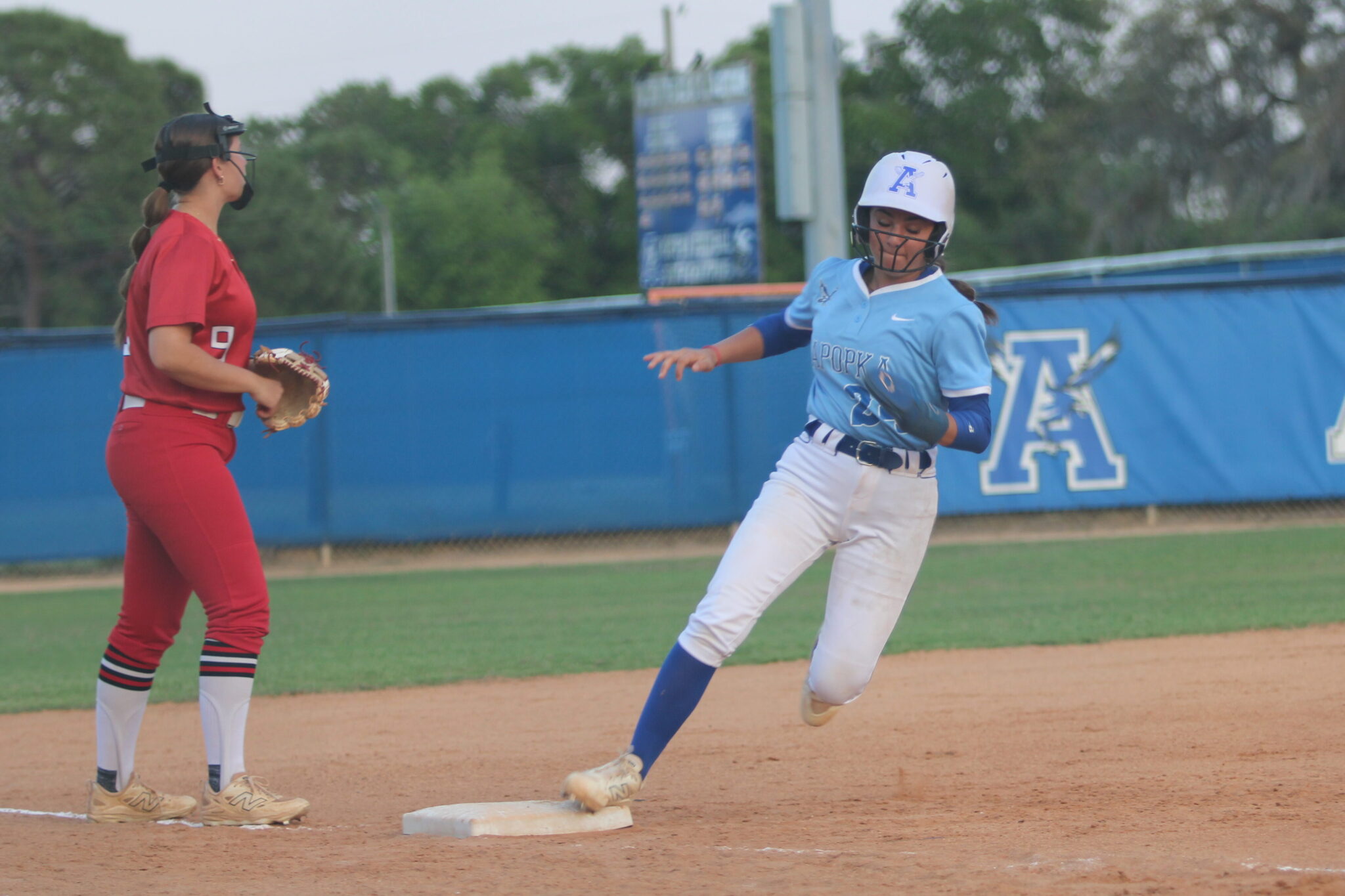 Shylah Pino rounds third base after Alicia Lopez drills a ball deep into the outfield in the first inning