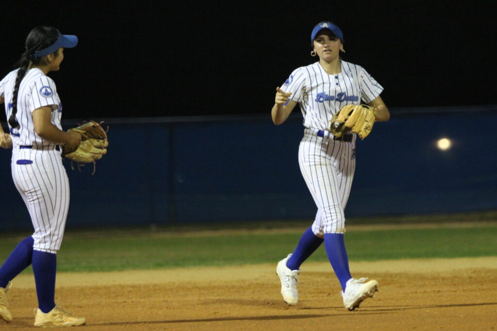 Shylah Pino runs back to the dugout after an out