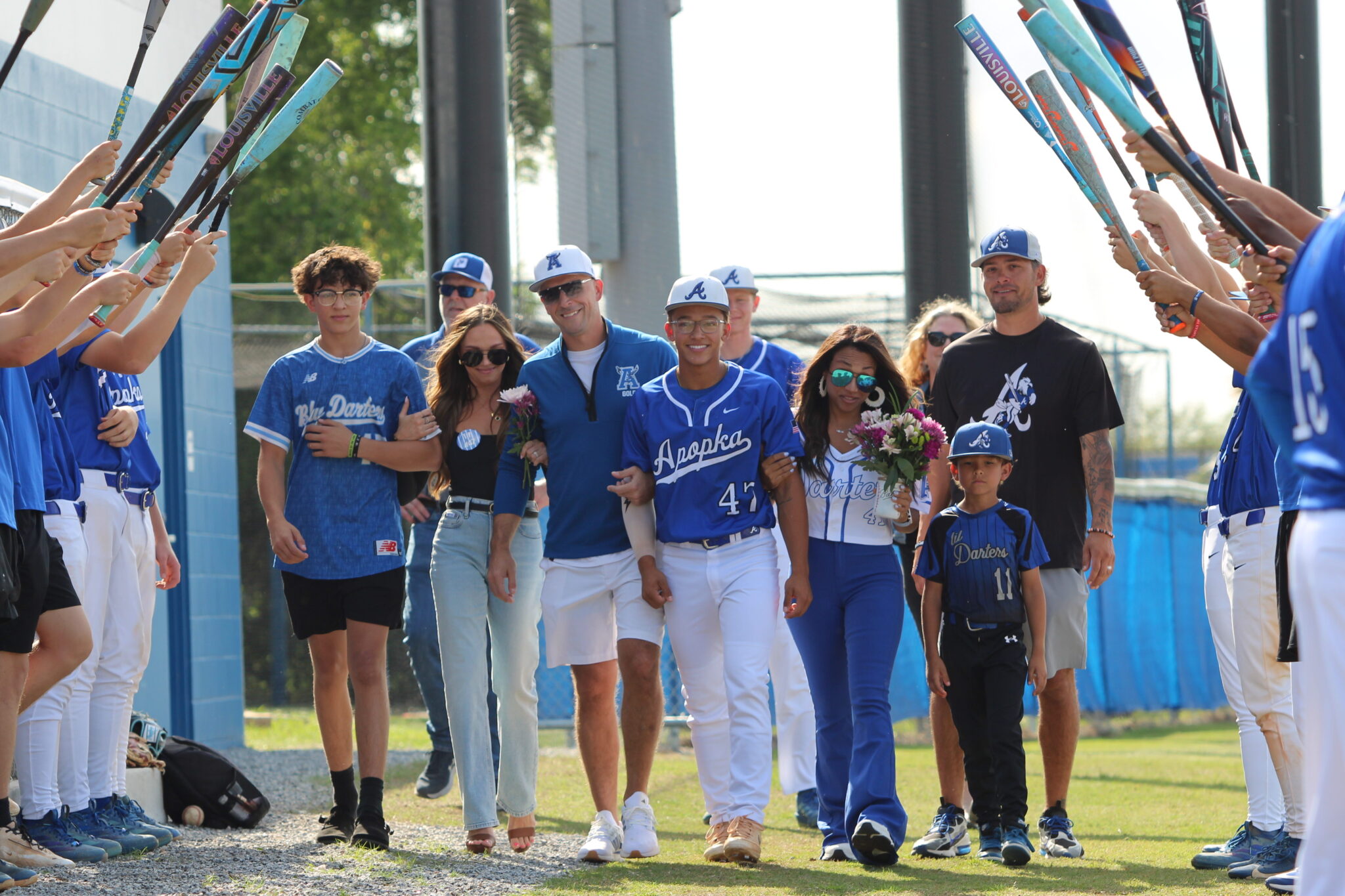 Ty Livingston walks out with his family on senior night