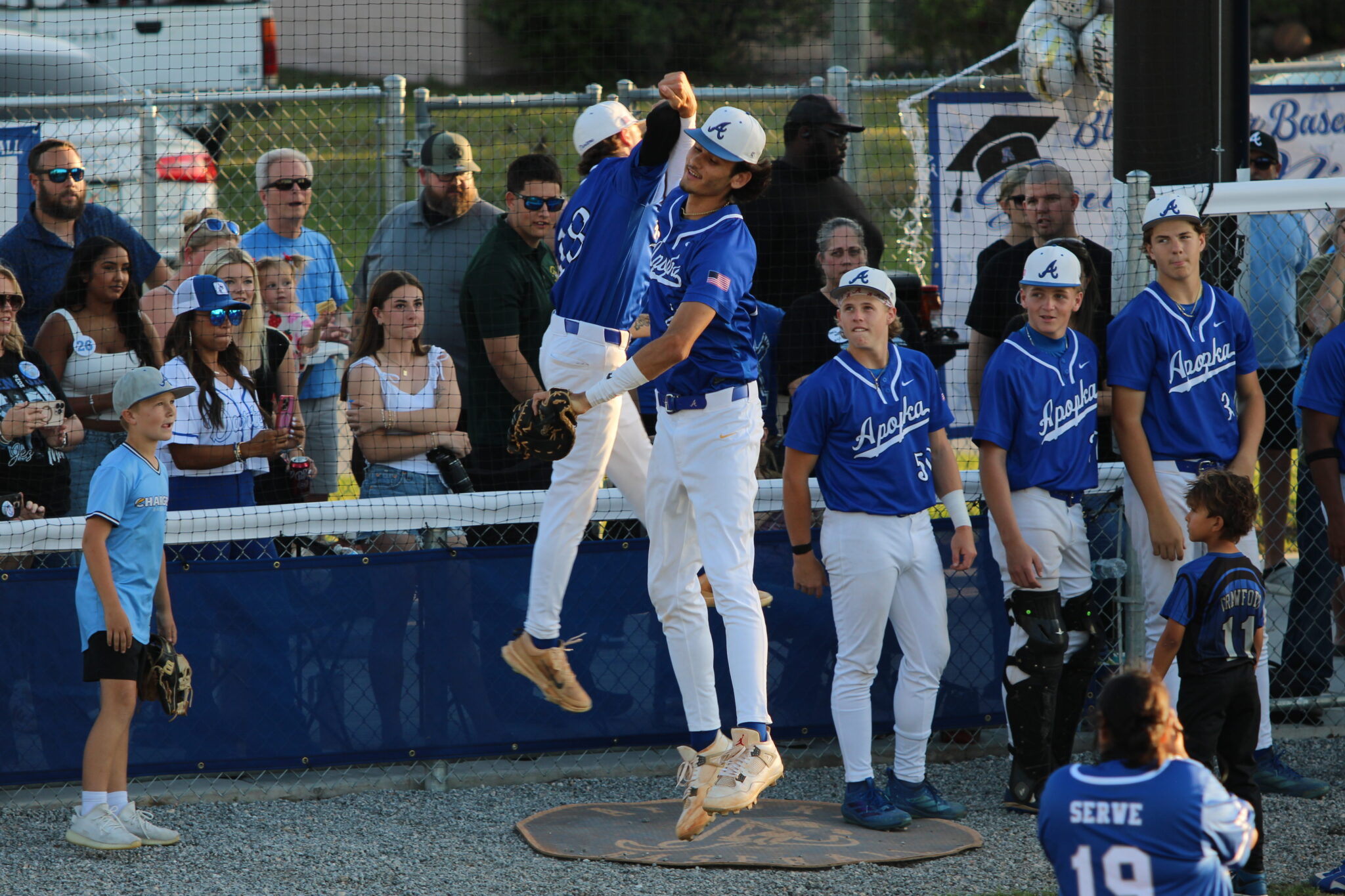 Tyler Spaid gets introduced in the starting lineup as Bryce Doss rises up to greet him