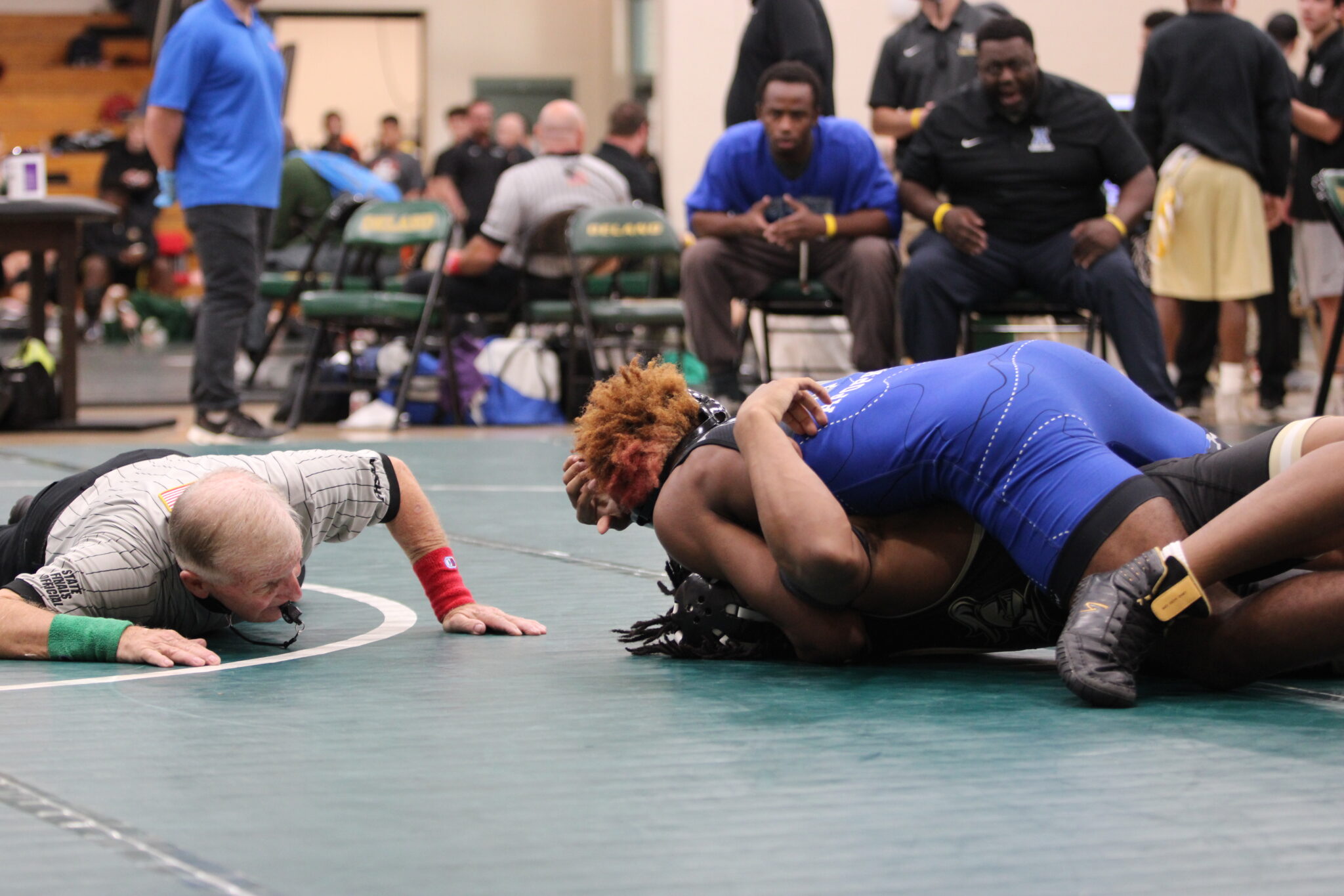 Uzziah Ockletree nearly pins his Oakleaf opponent in the first round of the regional tournament
