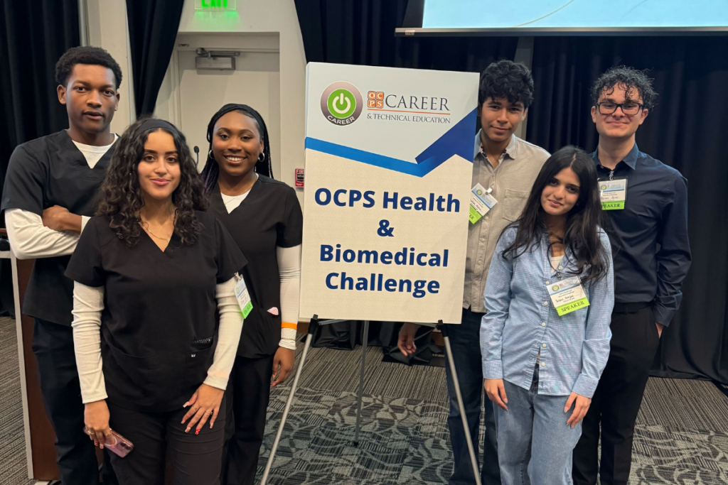 Apopka's Misinformation & Public Health Communication team (left) and the Wearable Health Tech & Remote Monitoring team (right) pose at the Orange County Public Schools Biomedical Challenge.