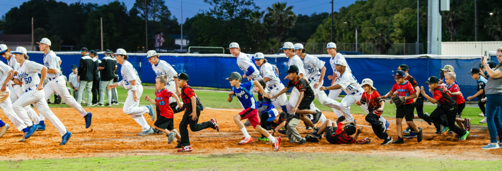 Little Leaguers ran the bases with players after the game.