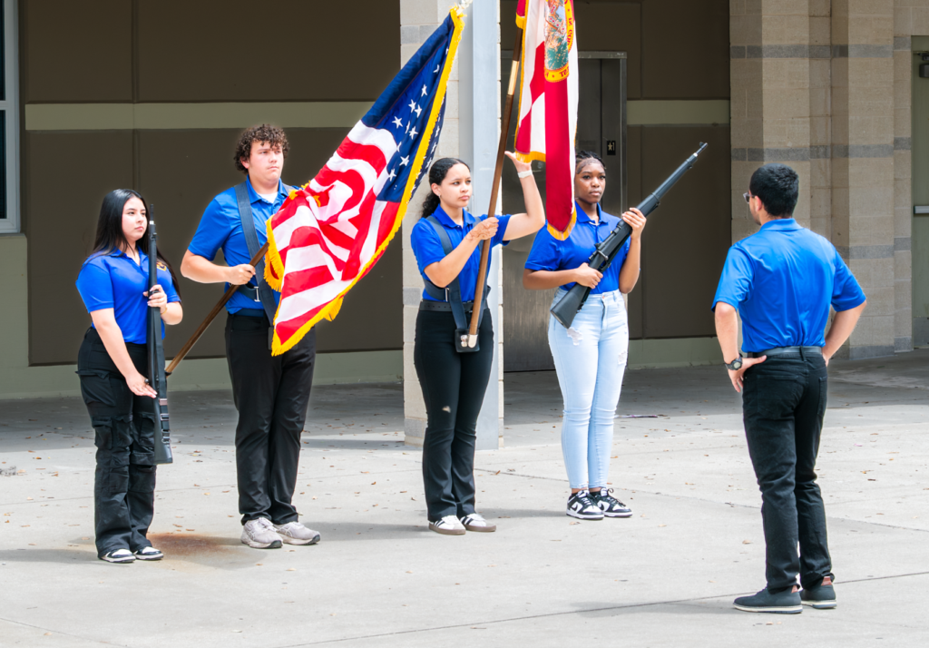 Cadets of Wekiva High School Air Force JROTC Color Guard practice in the courtyard ahead of their performance at Saturday’s Orlando Magic playoff game against the Detroit Pistons at the Kia Center.