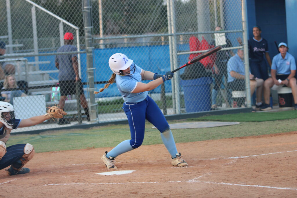 Alezia Hatcher drills a moon shot into center field and over the fence in the district championship against Lake Brantley