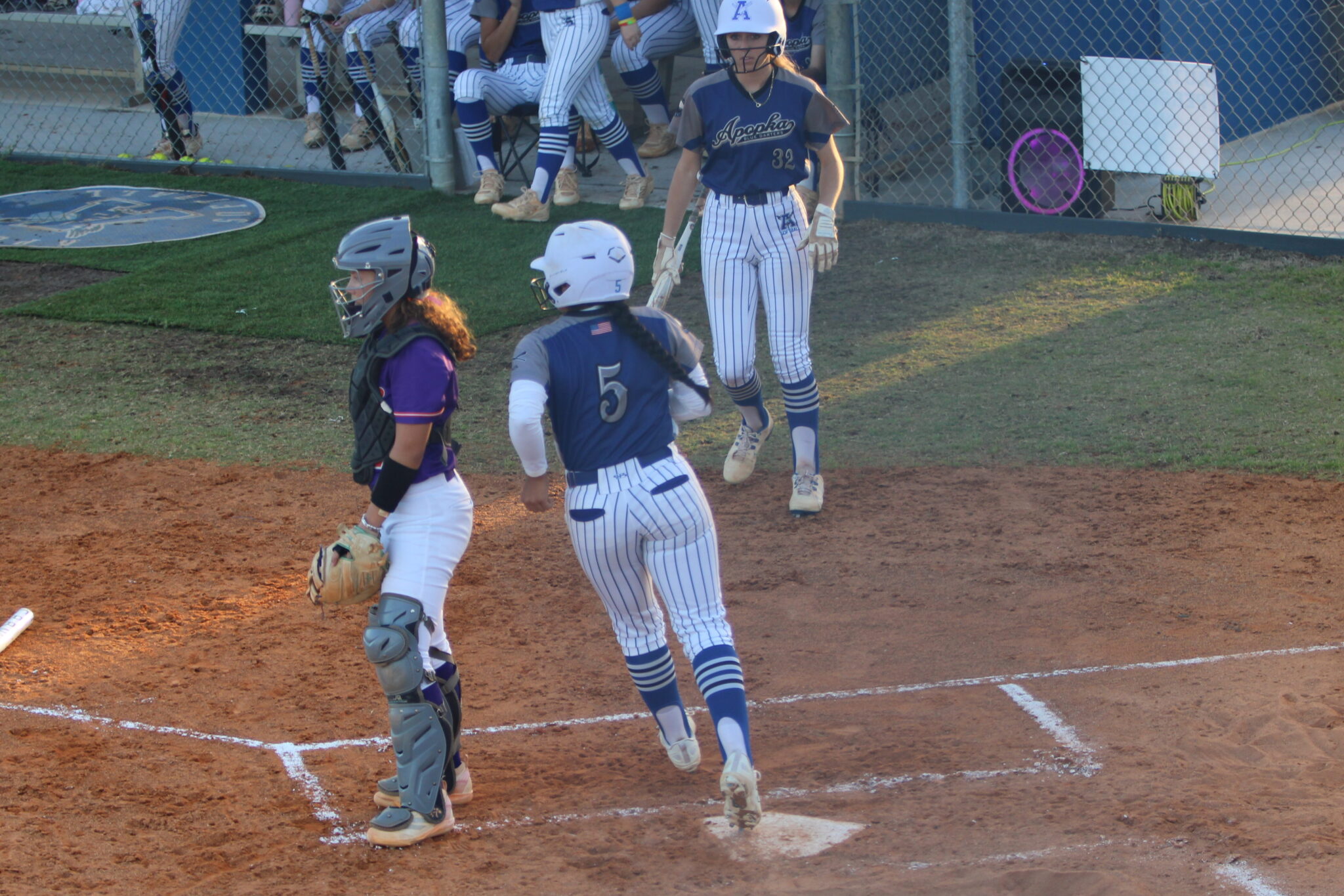 Alicia Lopez crosses the plate after Taylor Smiths hit