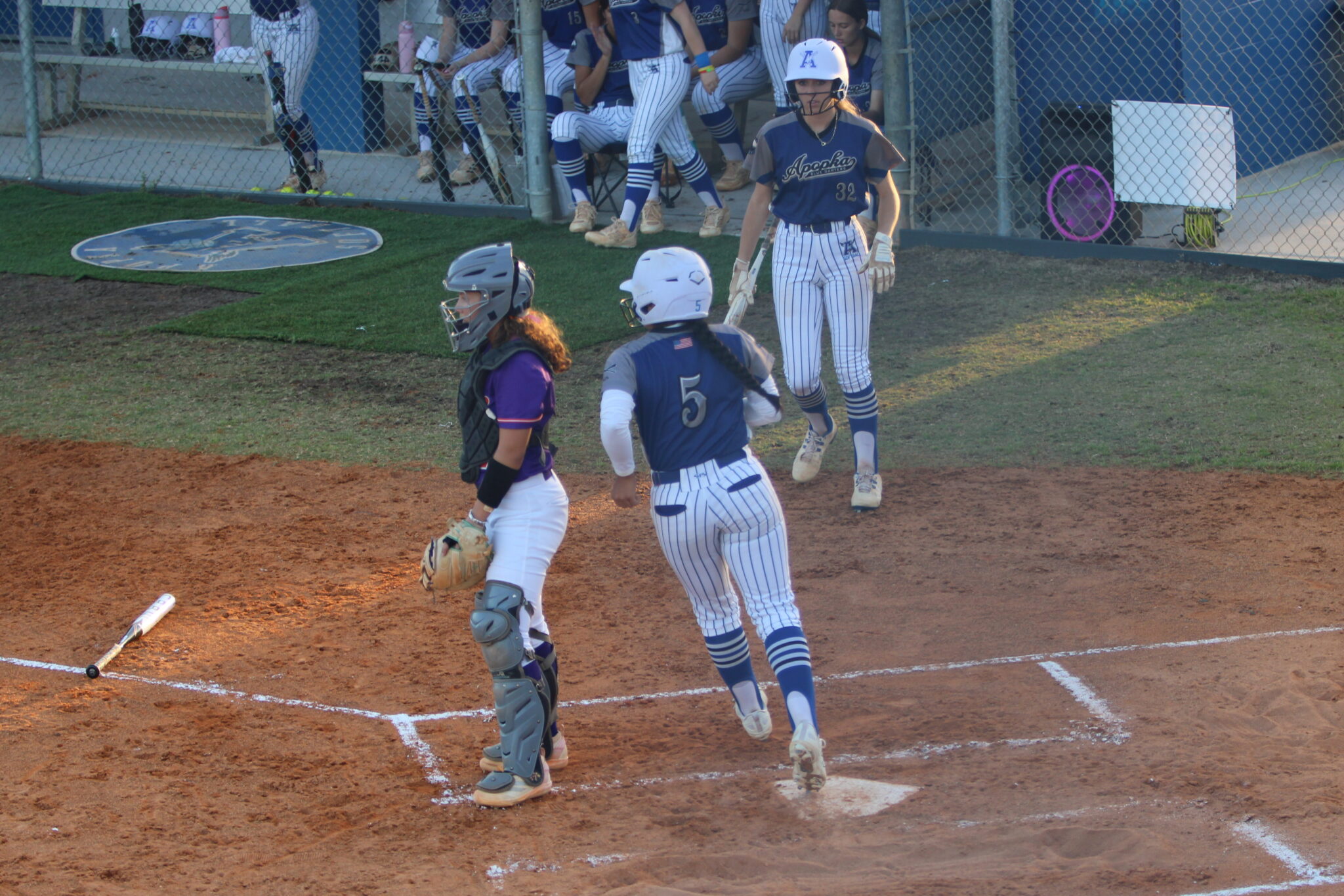 Alicia Lopez crosses the plate after Taylor Smiths hit in the first inning