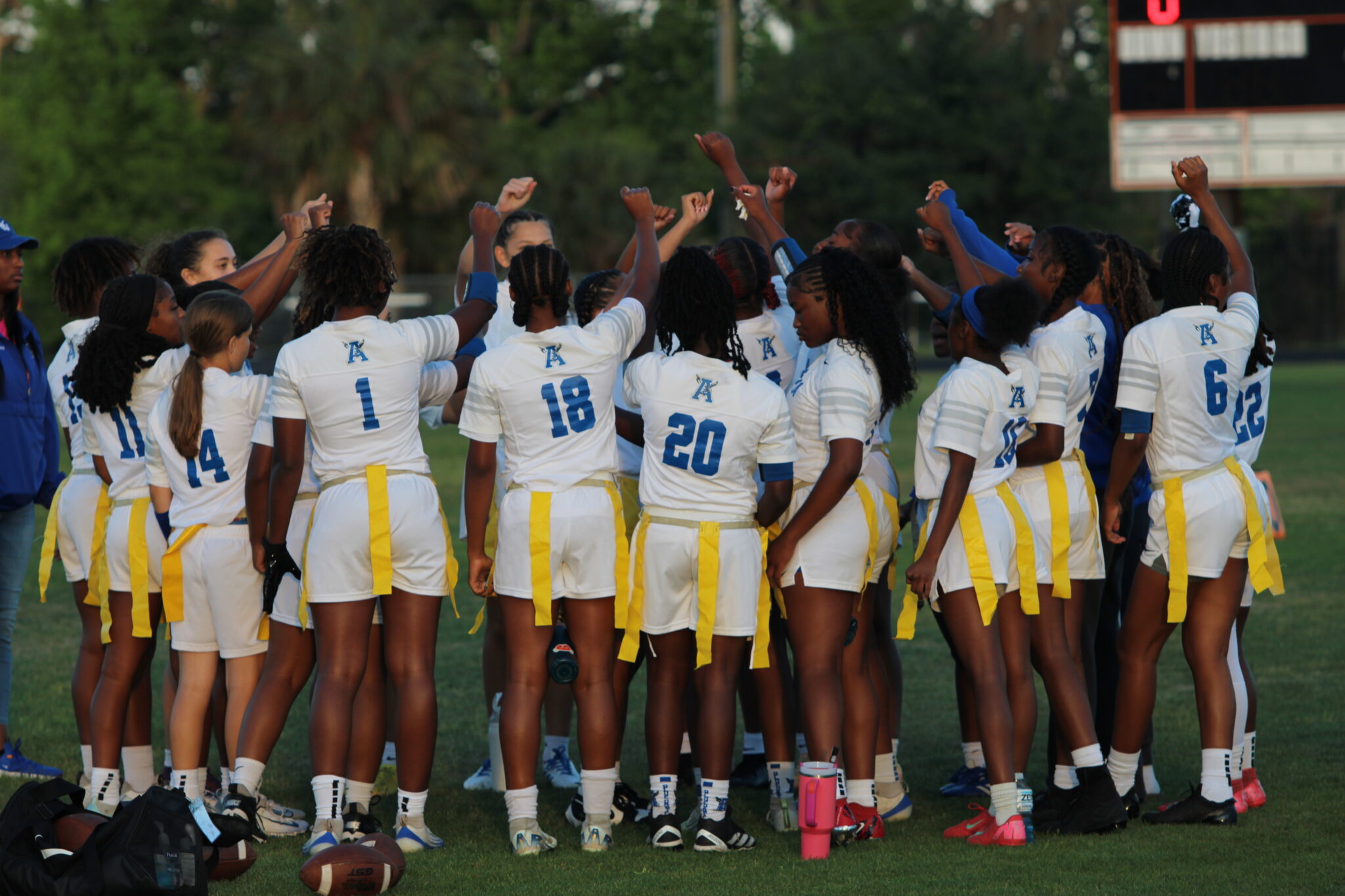 Apopka Blue Darters flag football huddle up before before their district semifinal battle with Seminole