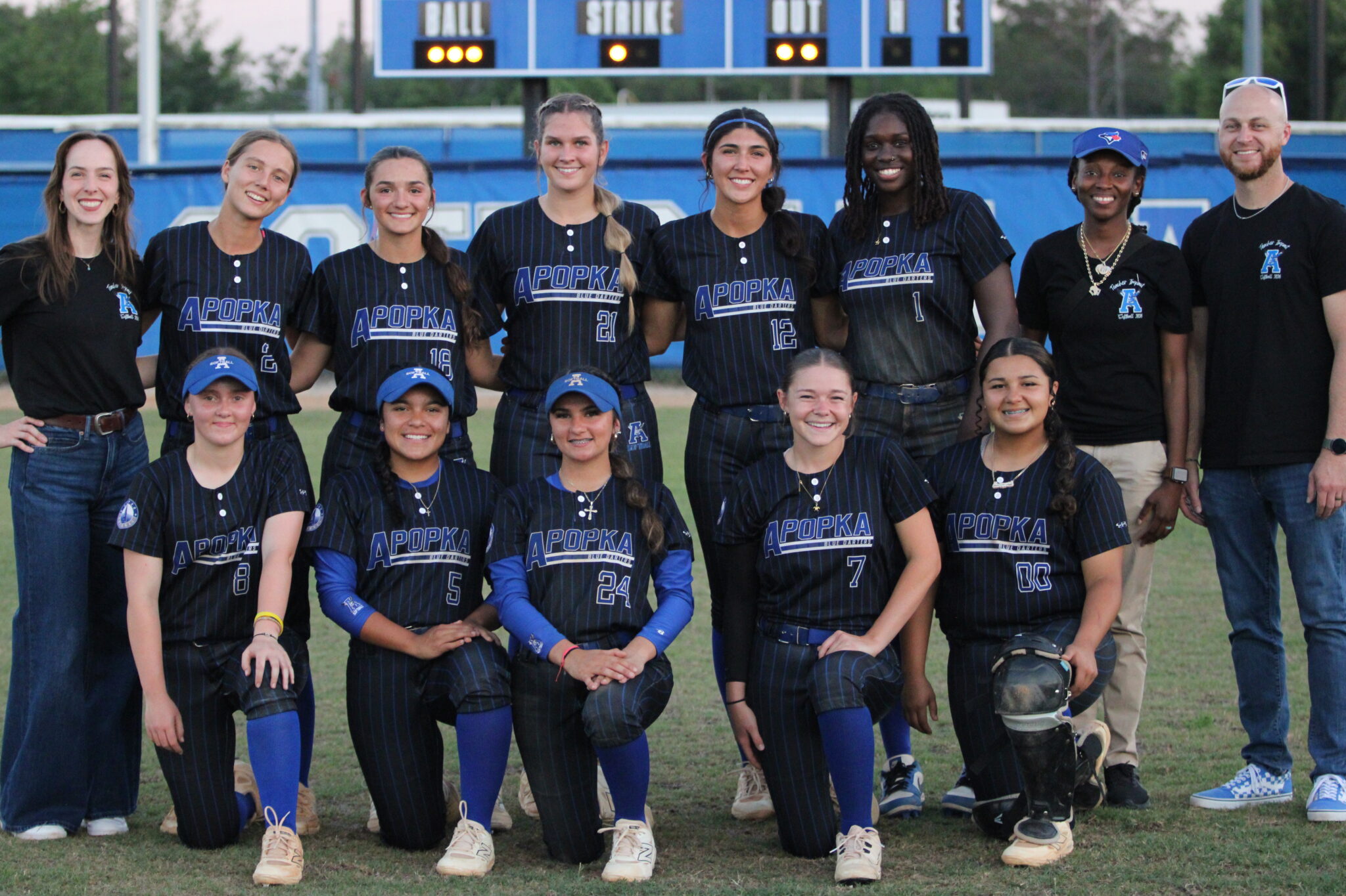 Apopka softball poses with a few teachers after their 15-0 mercy win over Innovation