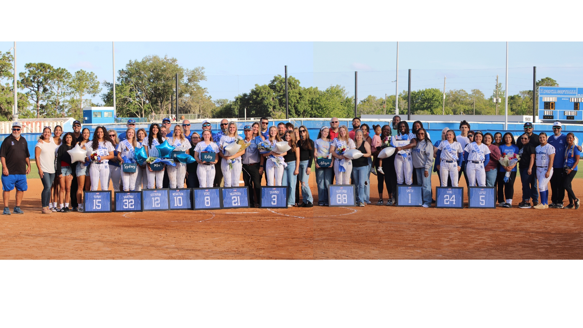 Apopka softball seniors families and coaches come together for a group senior night photo