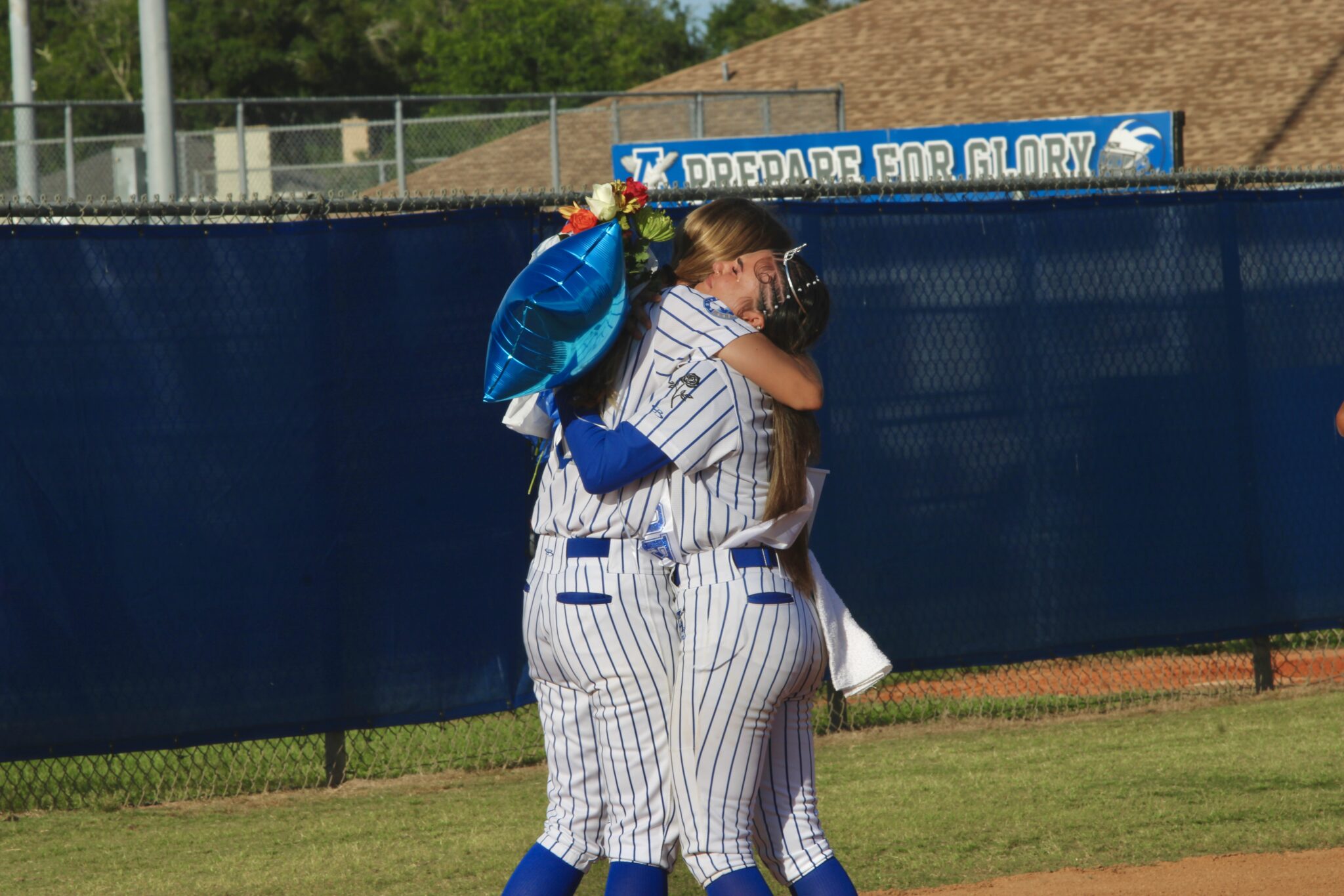 Ava Gonzalez and Shylah Pino share an emotional hug on senior night
