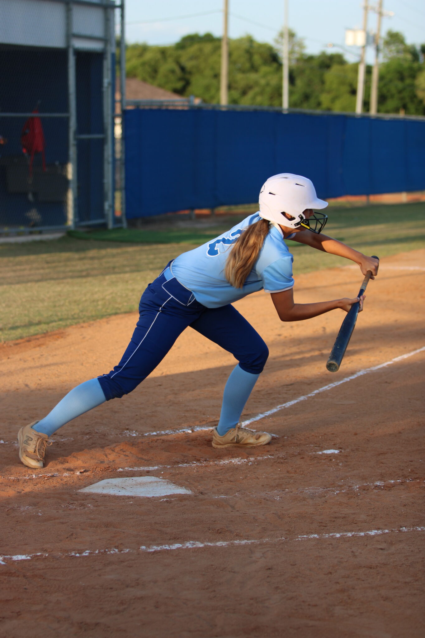 Ava Gonzalez lays down a sacrifice bloop bunt to score Taylor Smith from third