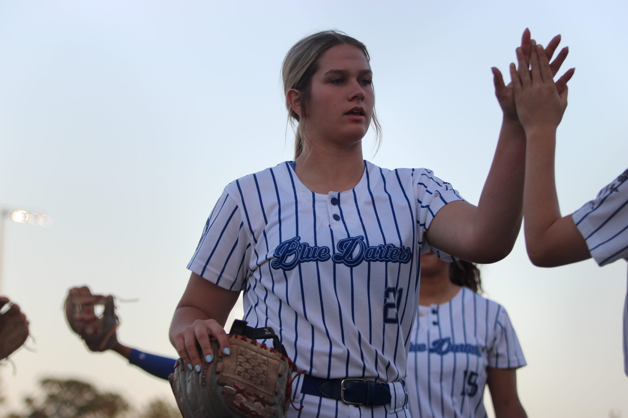 Ava Millspaugh comes off the field after her no hit, 2 strikeout inning