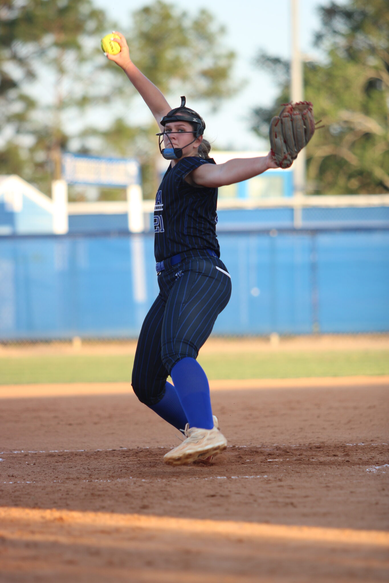 Ava Millspaugh steps through the pitching circle during her windup