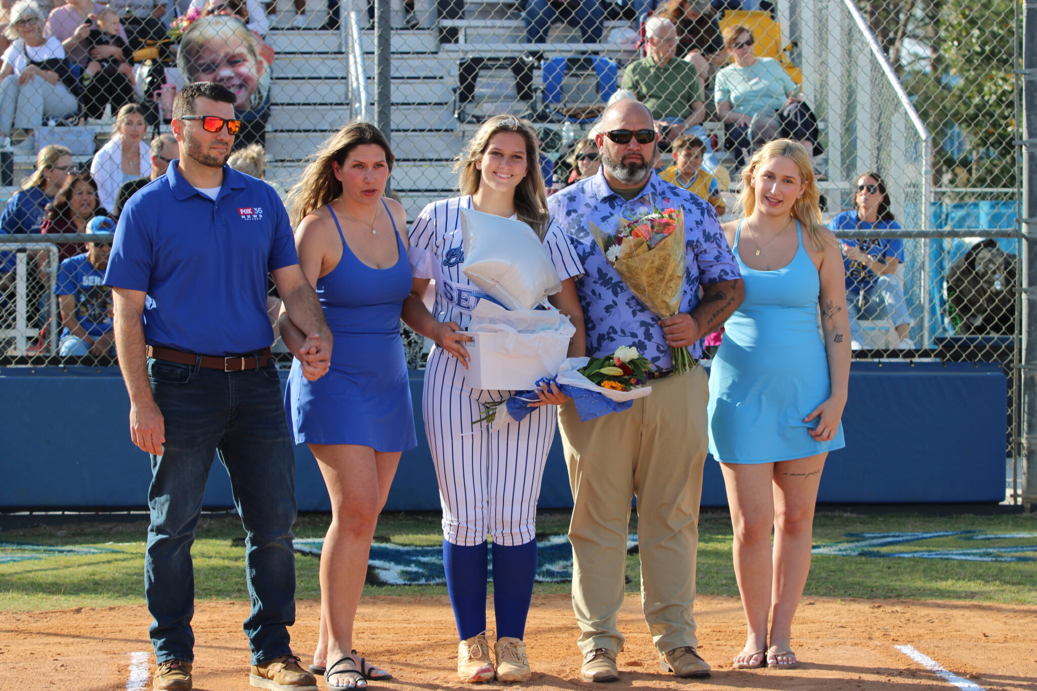 Ava Millspaugh with her family on senior night