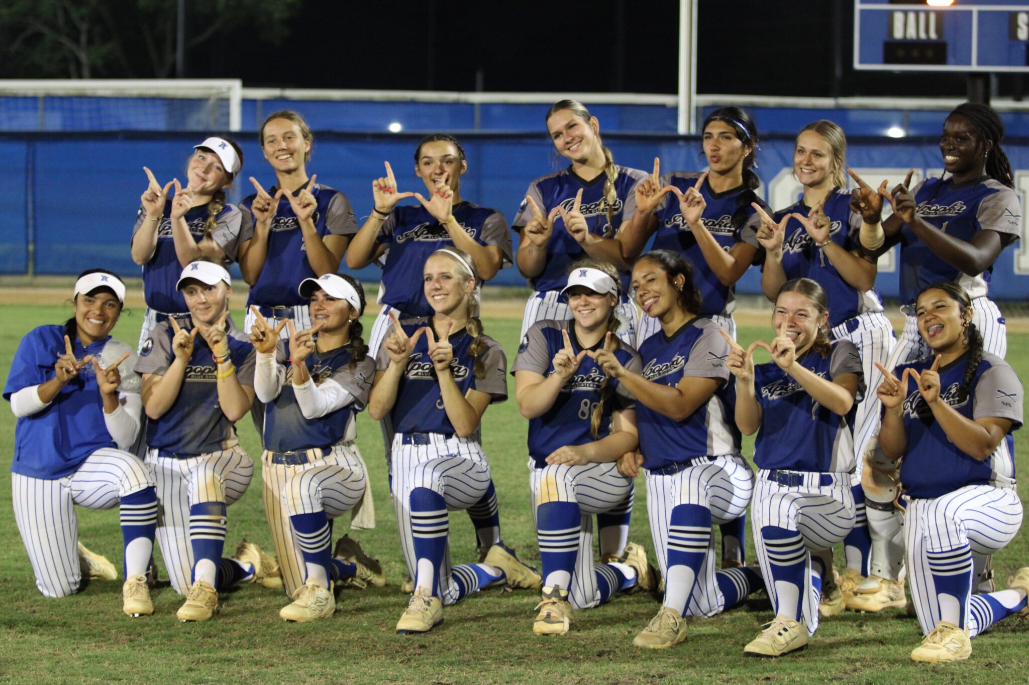Blue Darters group together after their district semifinal shutout over Seminole