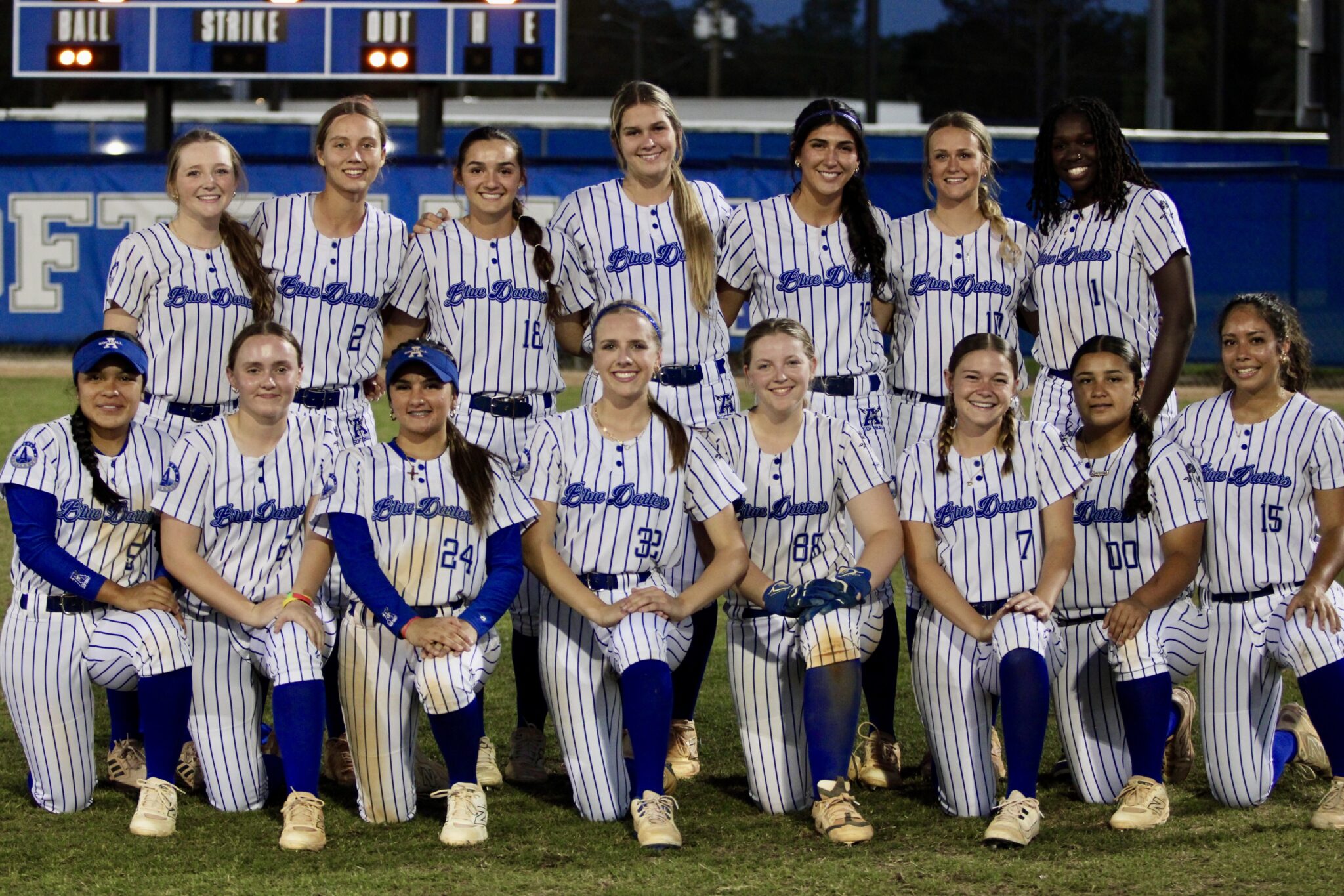 Blue Darters softball poses after their 3 inning, 15 run obliteration of Bishop Moore on senior night