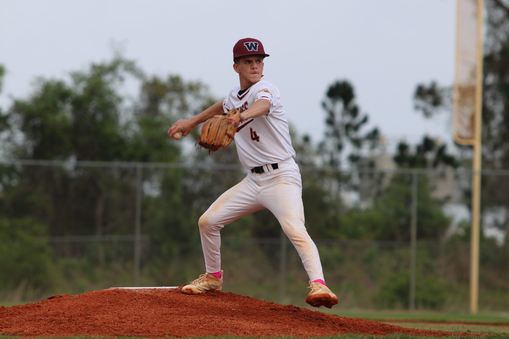 Brady Reinert winds back a pitch against Circle Christian