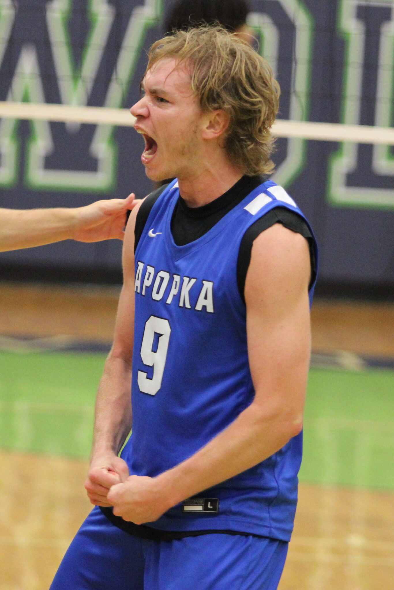 Caden McGatha amped over his pinpoint kill late in the fifth and final set