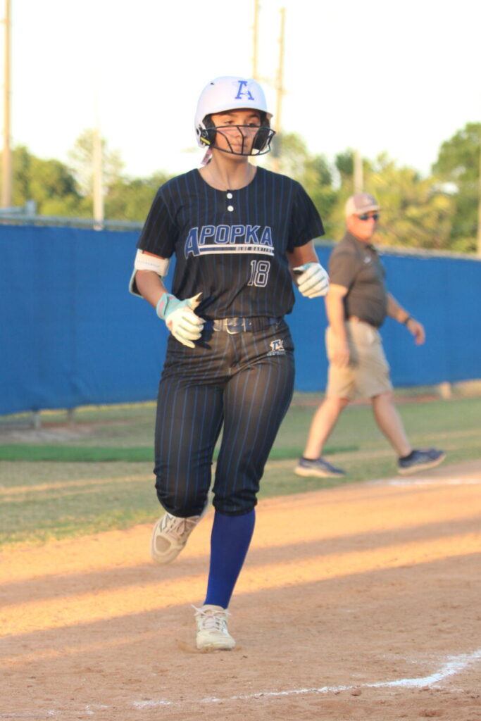 Callie Sowers runs to home plate during her inside the park home run