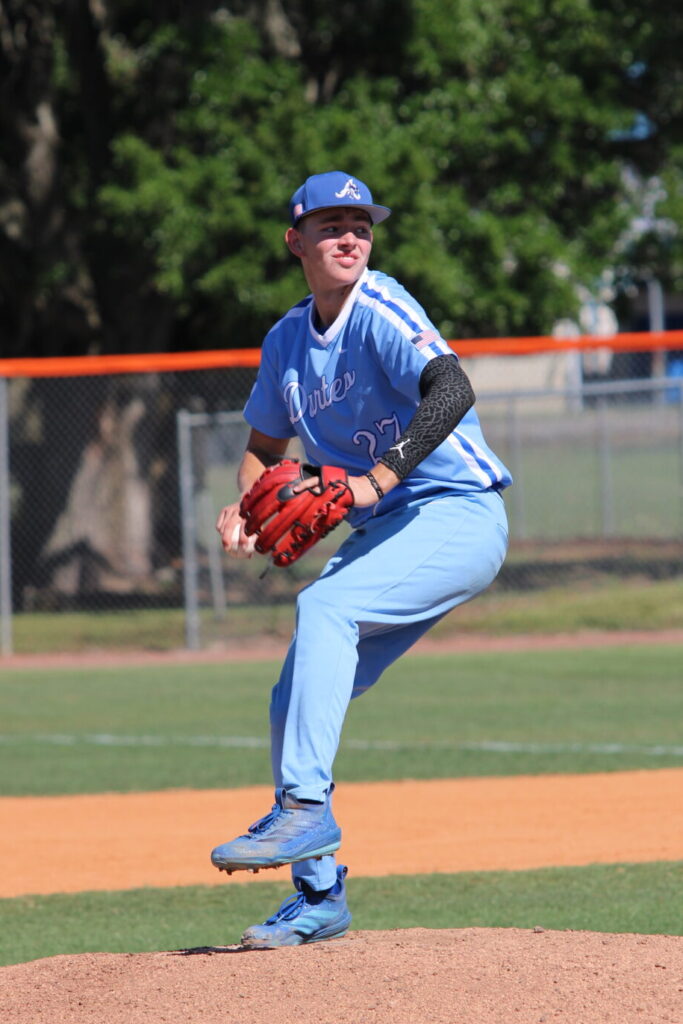 Camron Pennock begins to wind back a pitch against Lake Mary in the District Semifinal