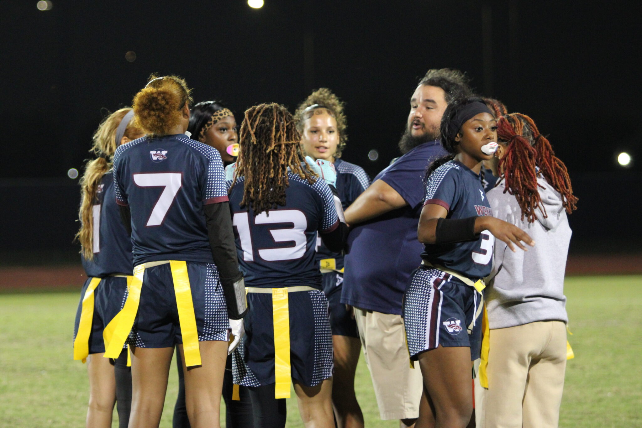 Coach Vazquez talks to his starters ahead of the fourth quarter