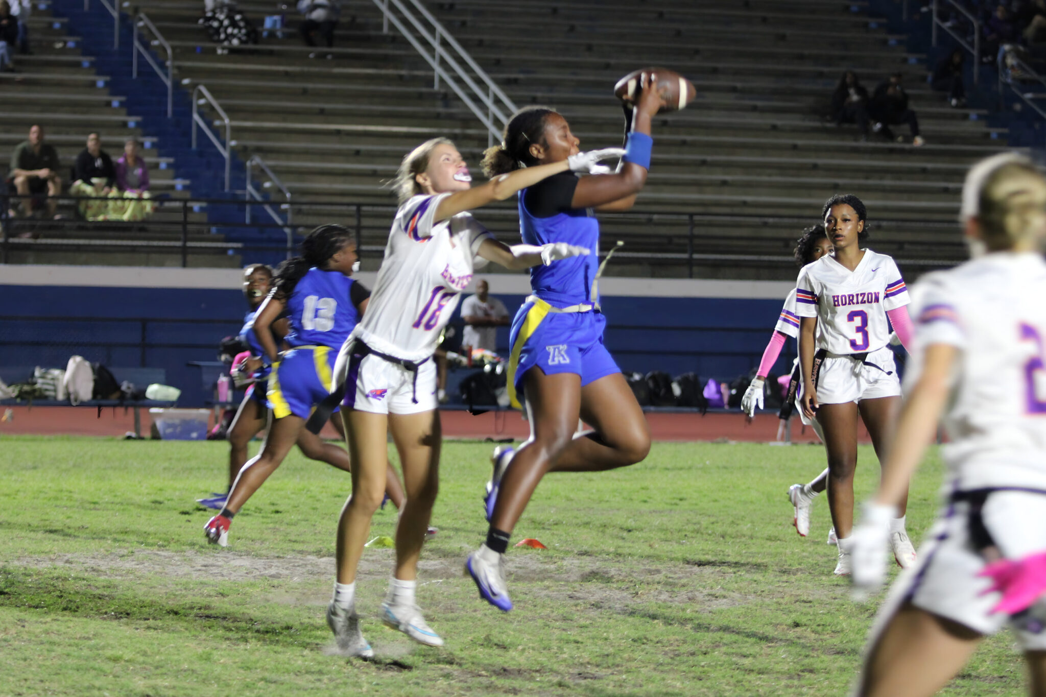 Elyse Pringle catches a touchdown pass from Mikayla Wiggins late in the fourth quarter