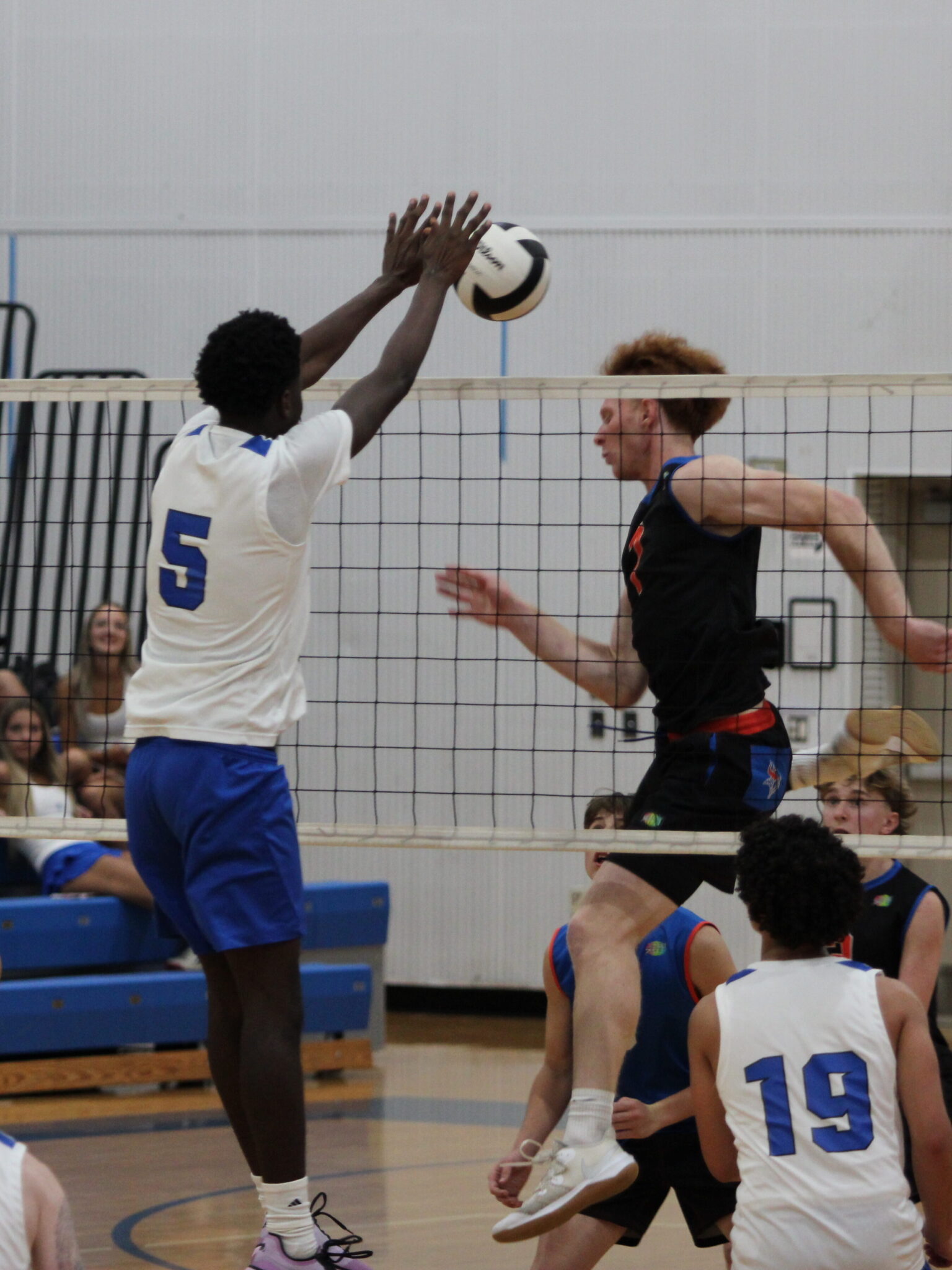 Giovanni Lubin stuffs the kill from the West Orange captain at the net