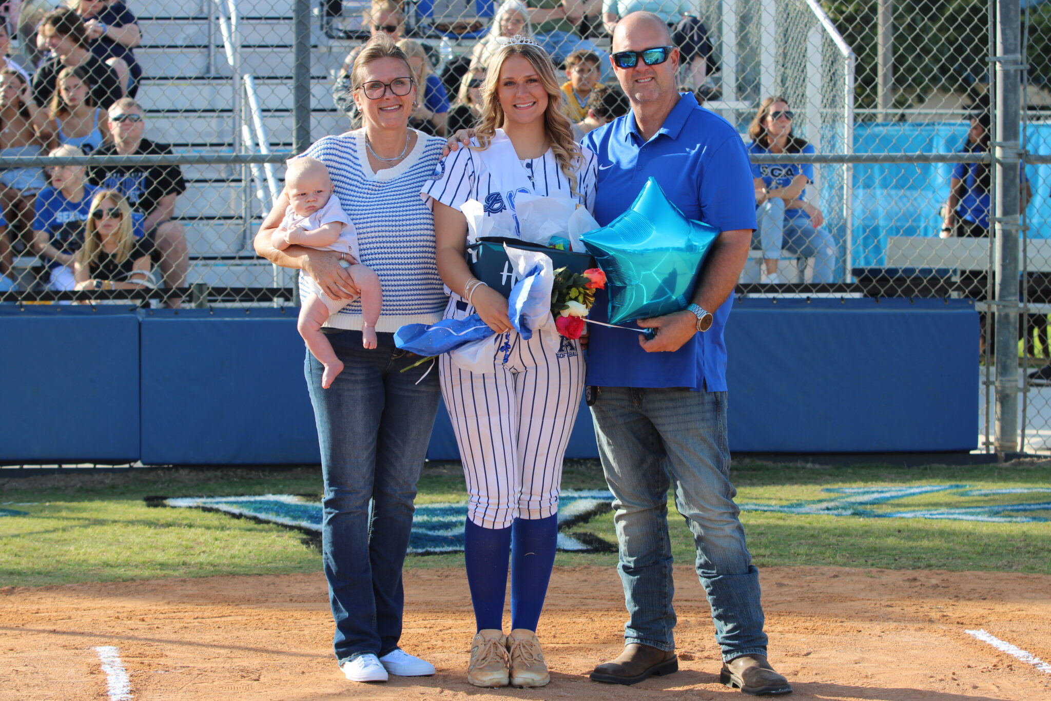 Hagan McGatlin poses with her family on senior night