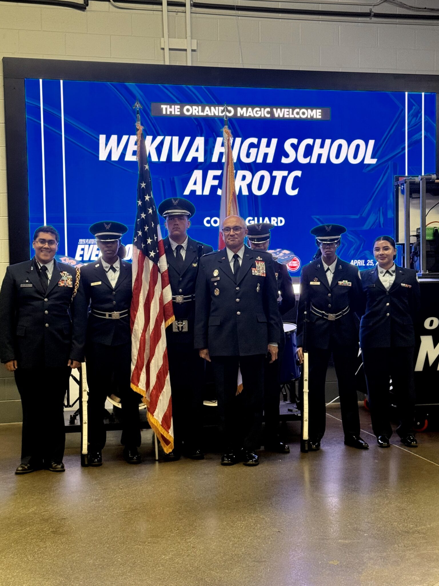 Wekiva AFJROTC stands in unison backstage of the Kia Center