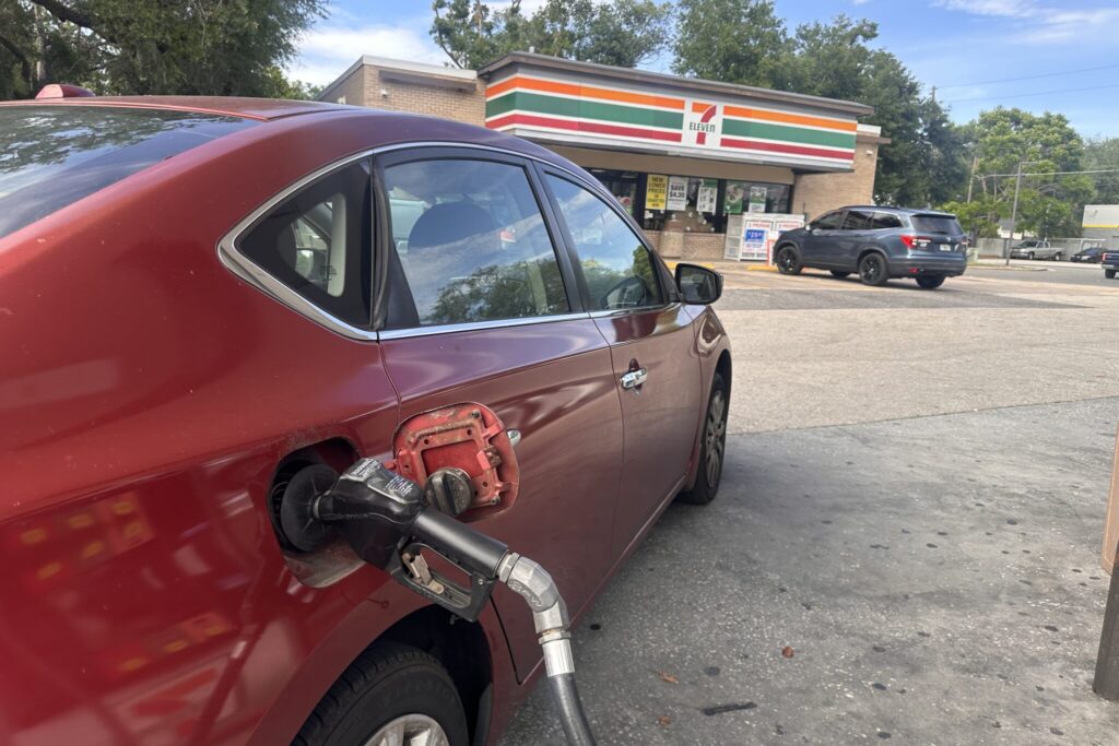 A driver fuels up at a 7-Eleven in Apopka as gas prices begin to rise again locally, reflecting a national increase driven by higher oil costs and tightening supply.