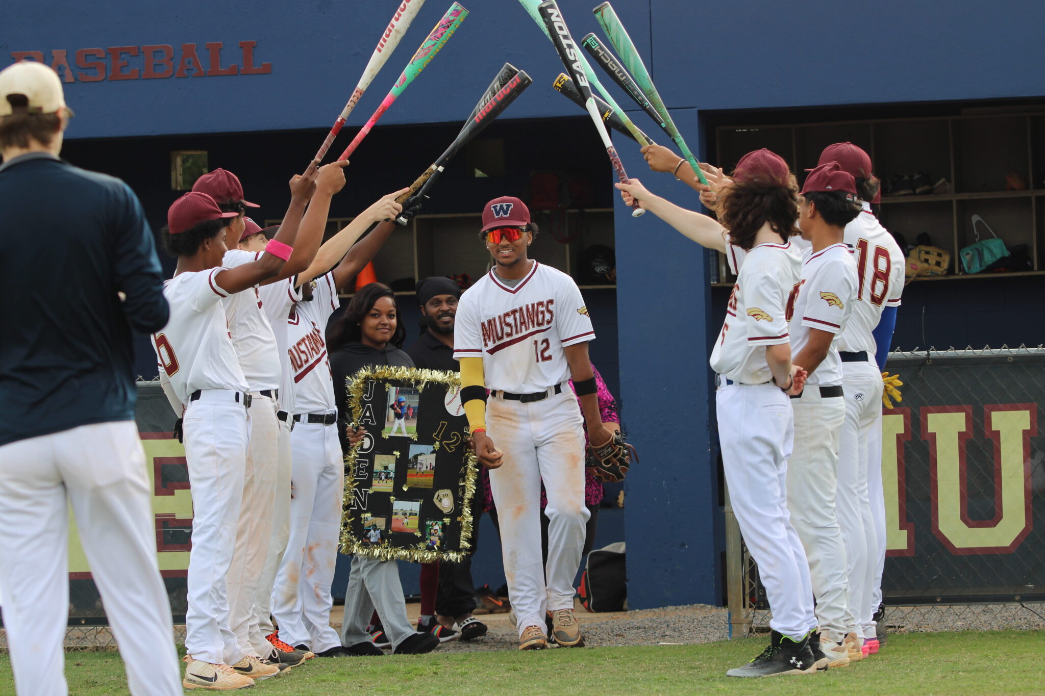 Jaden Graham walks out with his family on senior night